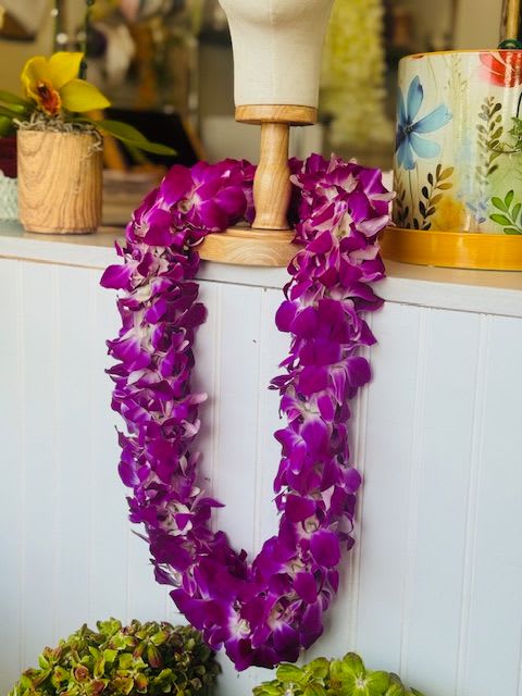 Lei - double dendrobium orchid leis available in Bombay (pictured) white, and green as well. Product is imported from Hawaii so allow at least a week ahead of time 