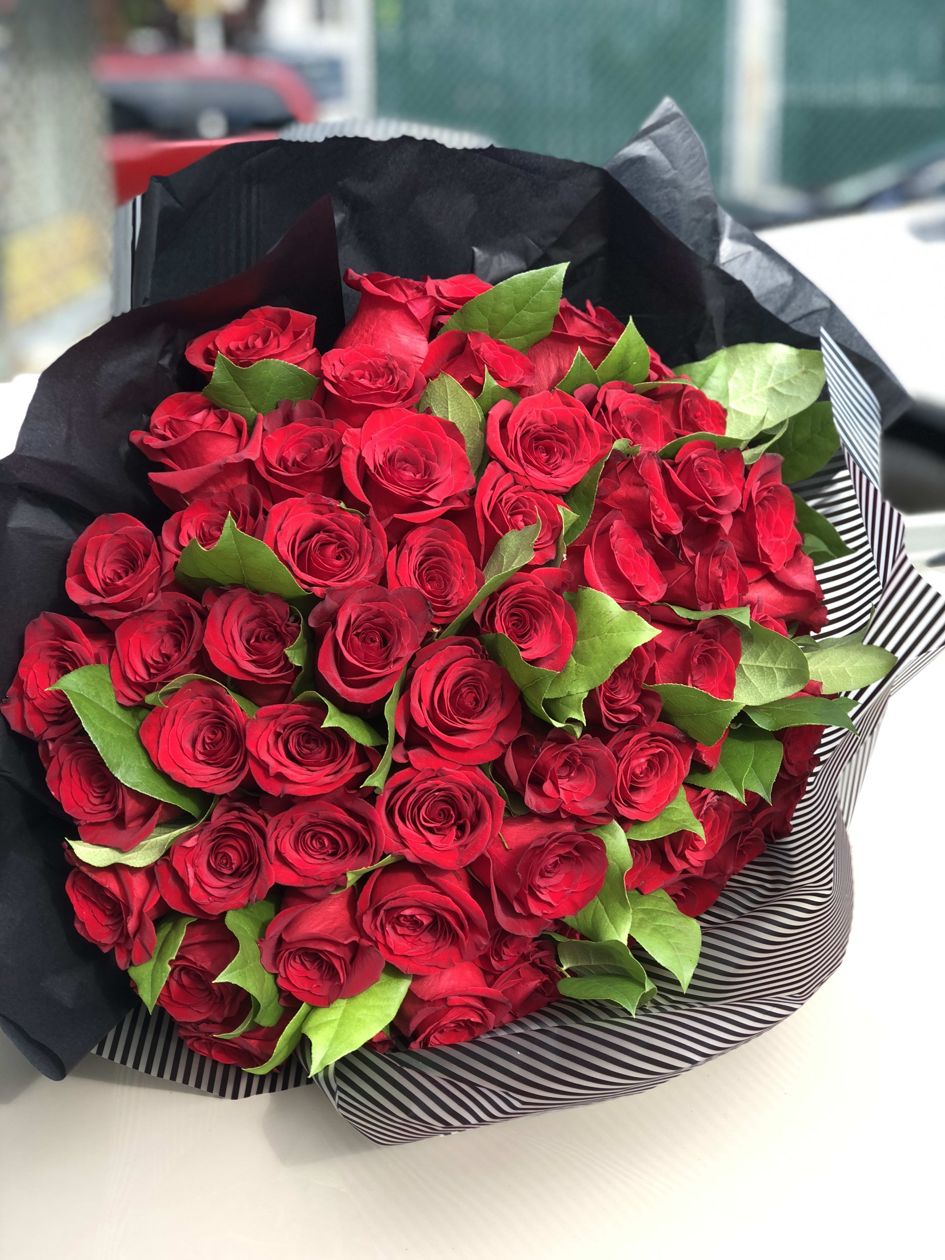 65 Red Rose Bouquet - 65 Long Stem RED ROSES is the Standard bouquet ,75 RED ROSES is the Deluxe bouquet and the 85stems of  RED ROSES is the Premium bouquet. 