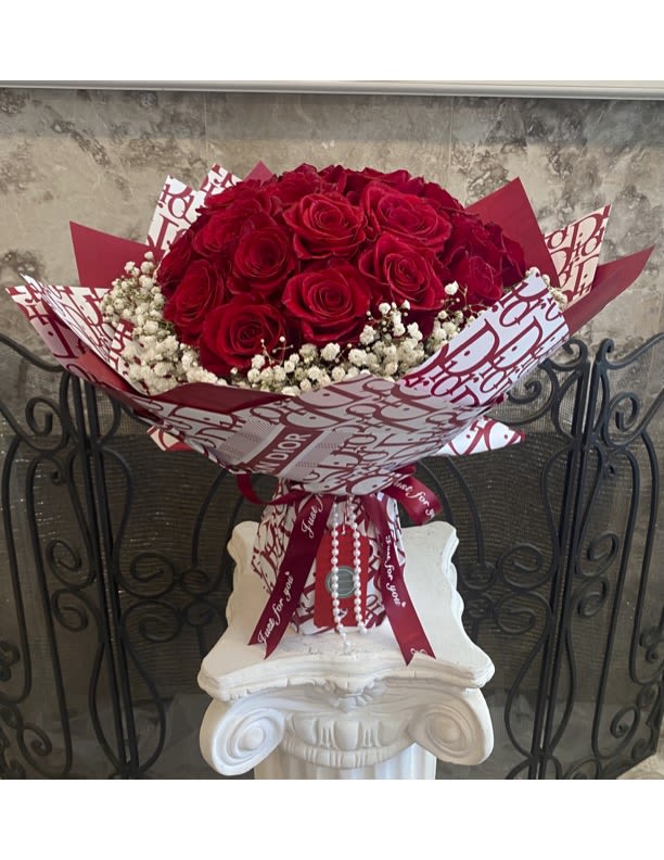 24 Red Roses With Baby Breath Designed Wrapping Waterproof Paper On Promotion - 18'' H  long Stems Red Roses With A Full Circle Baby Breathe With Designed Wrapping Waterproof Paper.The Designed Wrapping Waterproof Paper Pattern May Be Different Depend On Available.  Will Be Delivered Approximately As Pictured. Two Dozen. 