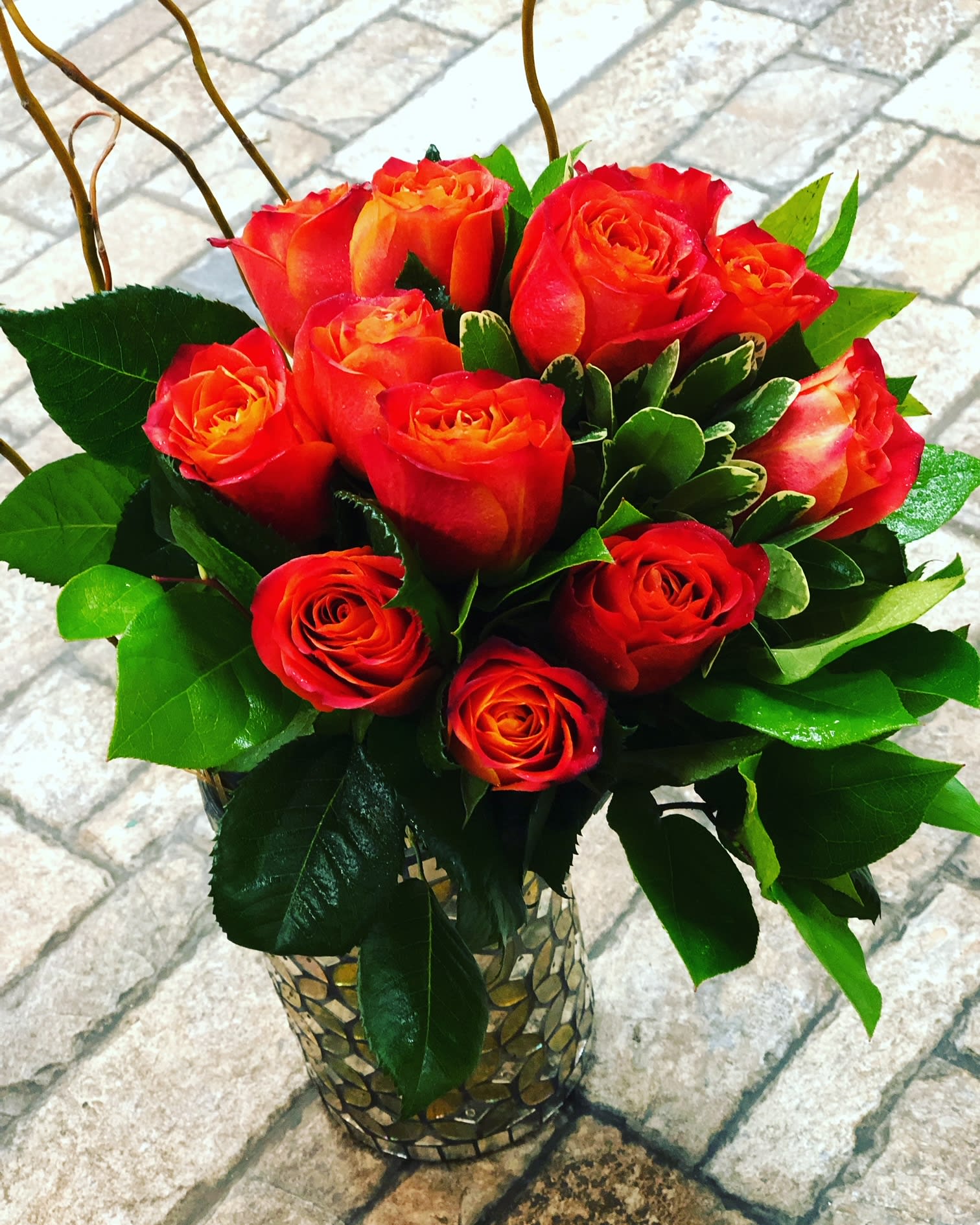 Orange Crush - 12 Vibrant Orange Roses arranged with assorted greenery. This bouquet is sure to impress your crush!