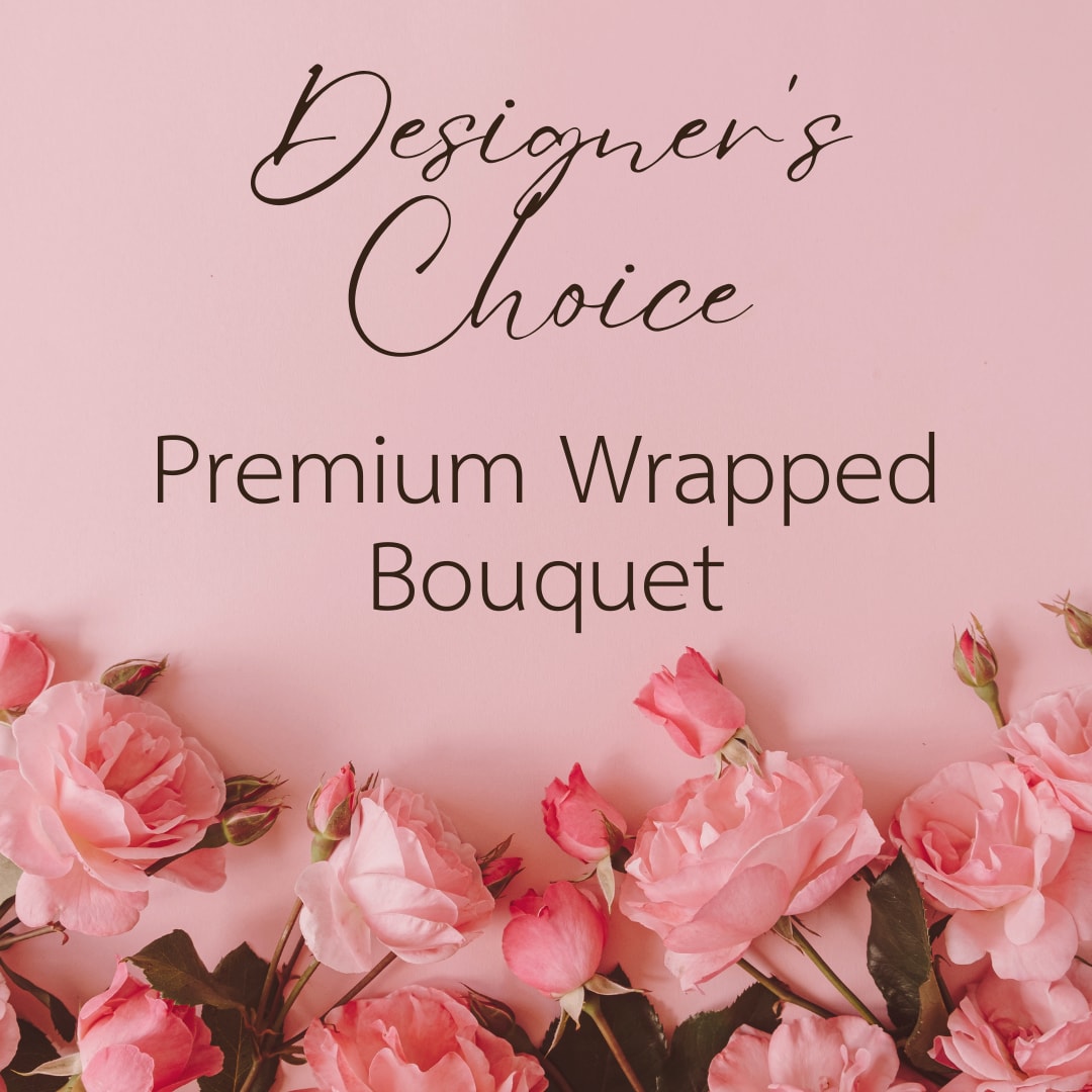 Premium Wrapped Bouquet - Designer's Choice  - A fresh mix of flowers and greenery wrapped in our premium floral paper. Perfect for date night! Wrapped arrangements do not include a vase and should be placed in water immediately.