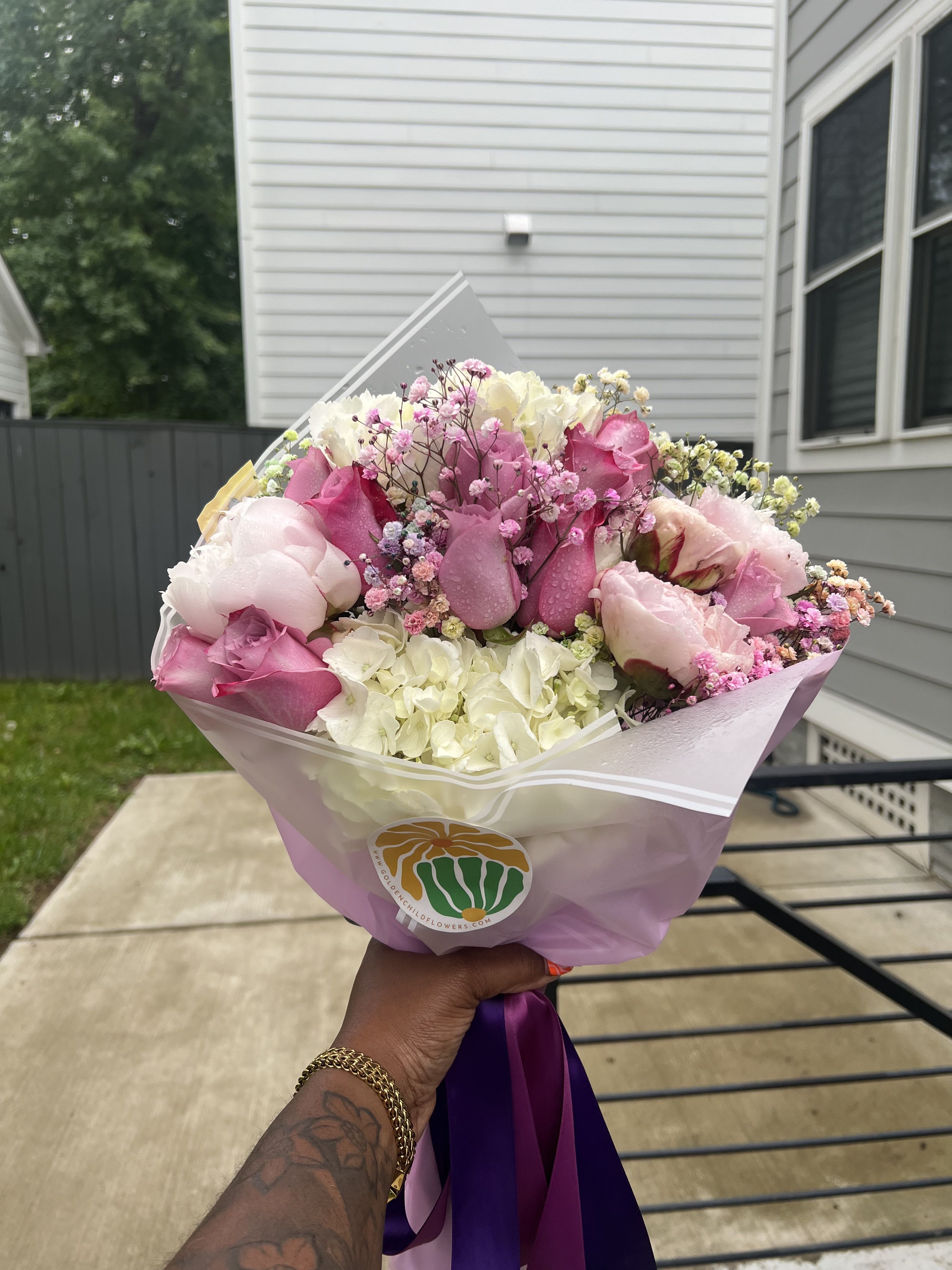 Miss Lav - A whimsical blend of soft pink and rich purple hydrangeas, delicate peonies, cosmic baby’s breath, and classic roses — originally designed for a tiny ballerina or princess, this enchanting arrangement brings fairytale elegance to any occasion.  Please note: Peonies are seasonal and may be substituted with a similar bloom when unavailable.