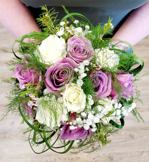Lovely Lavender and White Hand Held Bouquet - Lavender and White Roses with Babies Breath and other accents. Deluxe choice will include more flowers. Premium choice will include more flowers and fairy lights for a beautiful glow.