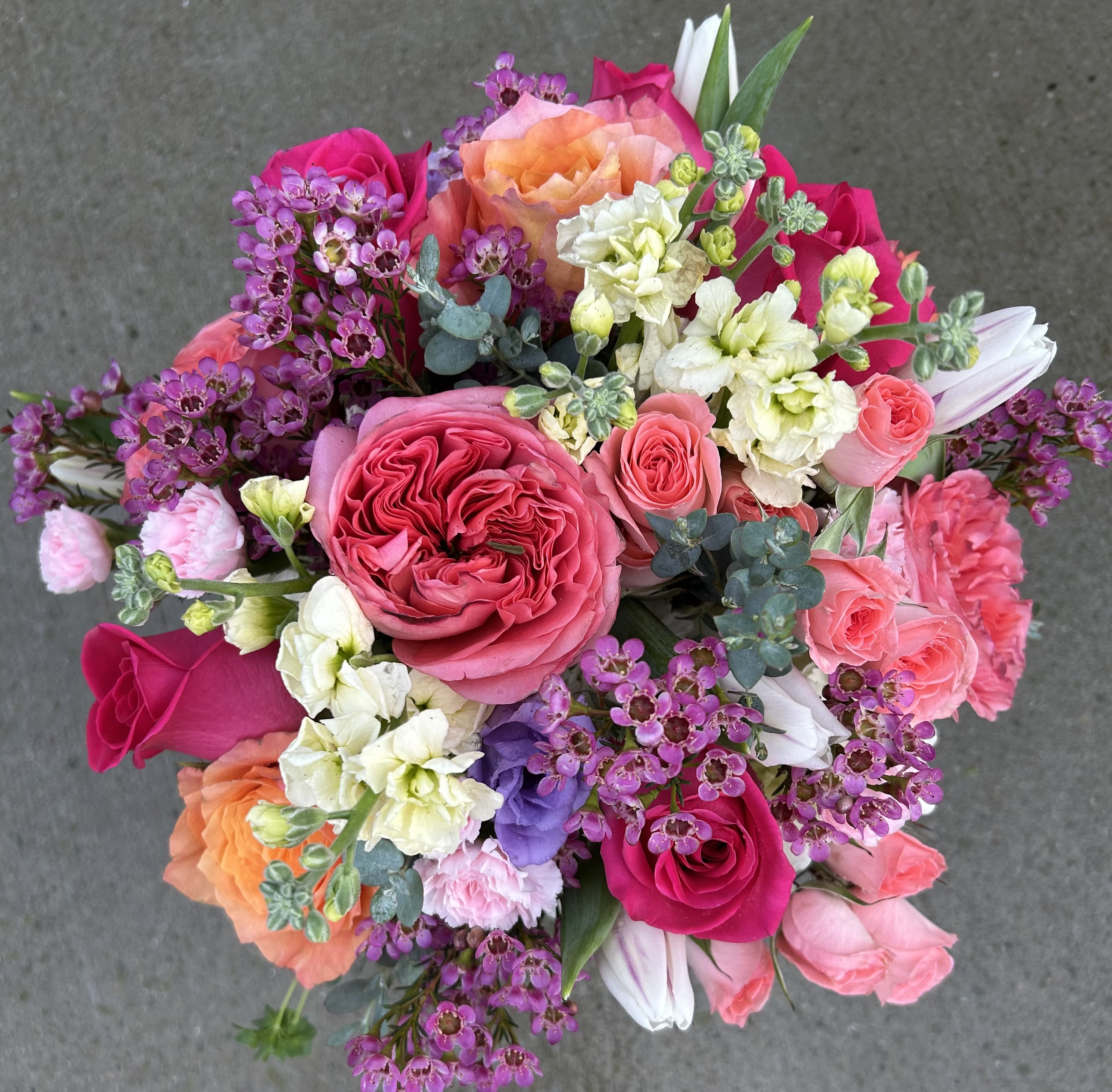 Sophia's Antique Garden Bouquet - A beautiful assortment of garden roses, tulips, stock and spray roses with accent flowers in a gathering vase. This arrangement would be a perfect choice for birthdays, anniversary or just because. Tulips will be added if available. We will add a suitable replacement of the same value.