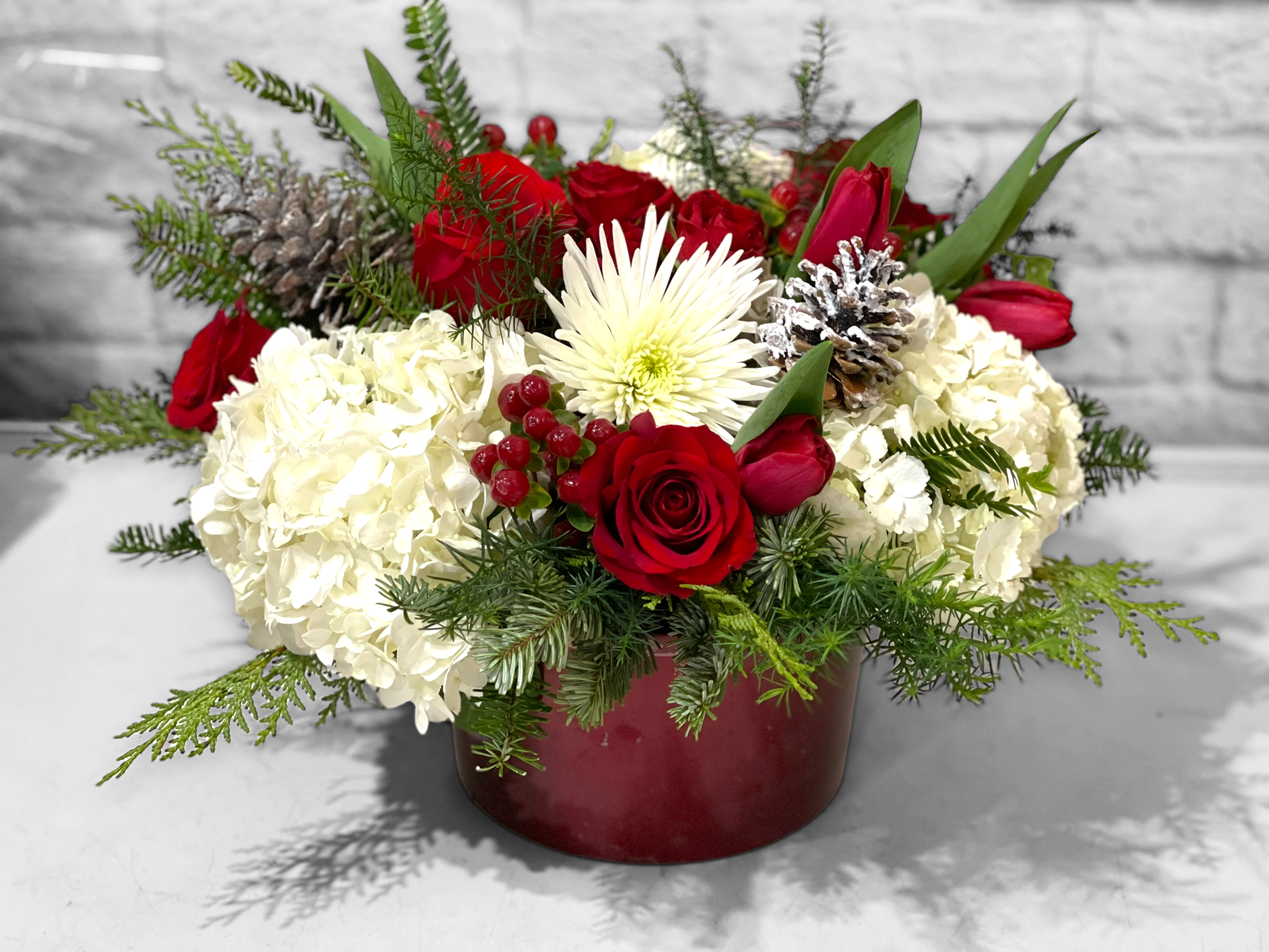 Frosty Kiss (In white vase) - Send warmth and holiday cheer with this “frosty” bouquet that is sure to brighten any space for Christmas! 