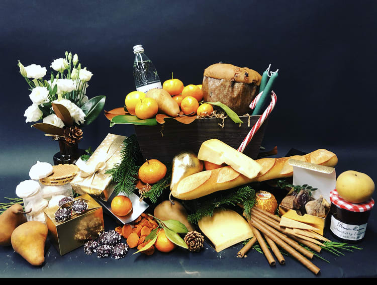 Holiday Gift Basket Series Sleigh Bells - Holiday themed gift basket with a mix of sweets and fruits. Flower arrangement included.