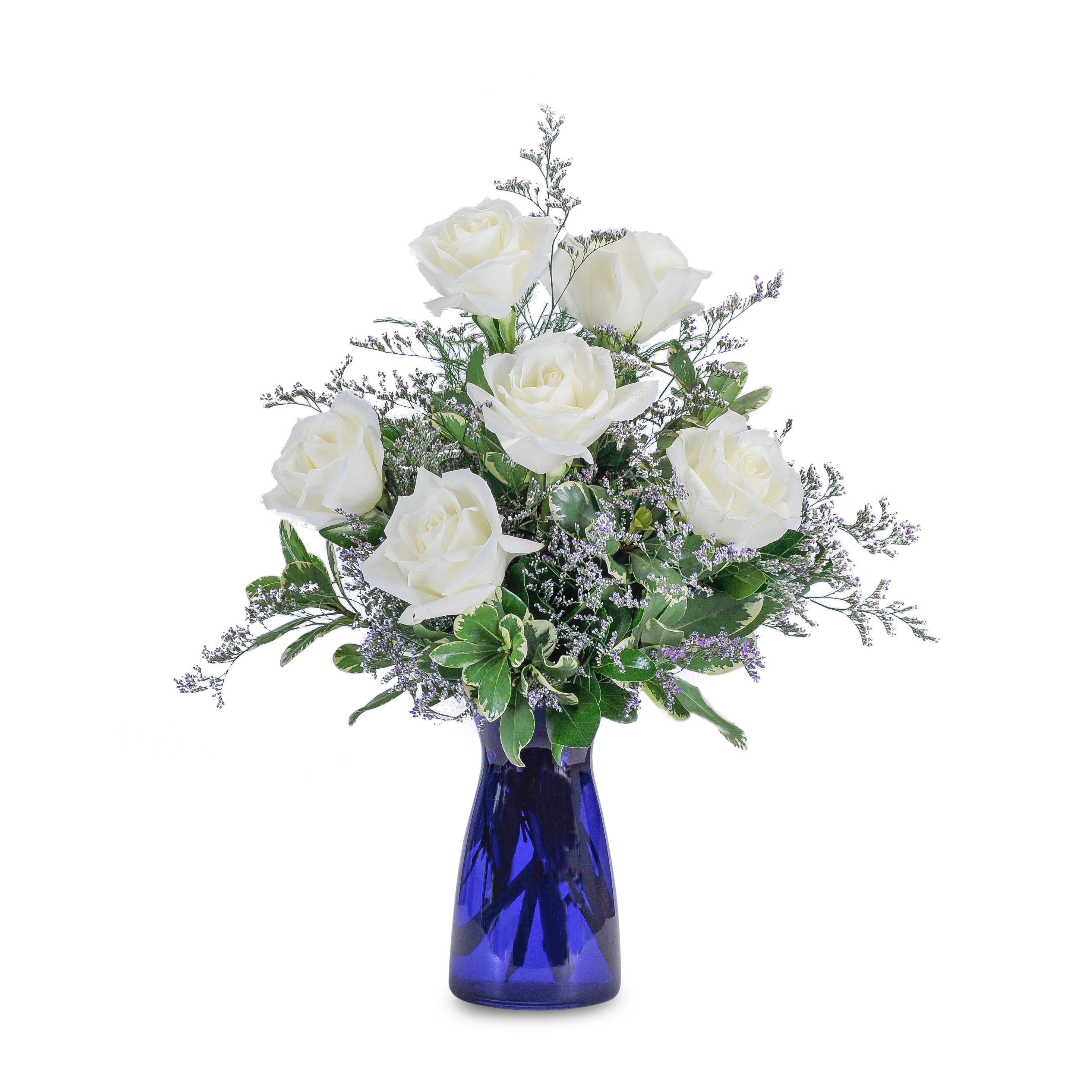 Roses in Blue - TMF-192 - "A combination of elegant white roses, lavender accent flower and variegated foliage in a cobalt blue glass vase will make a great gift for that special occasion.  Crisp white roses, soft limonium and assorted foliage in a blue glass vase." Approximately 8” (W) x 15" (H)