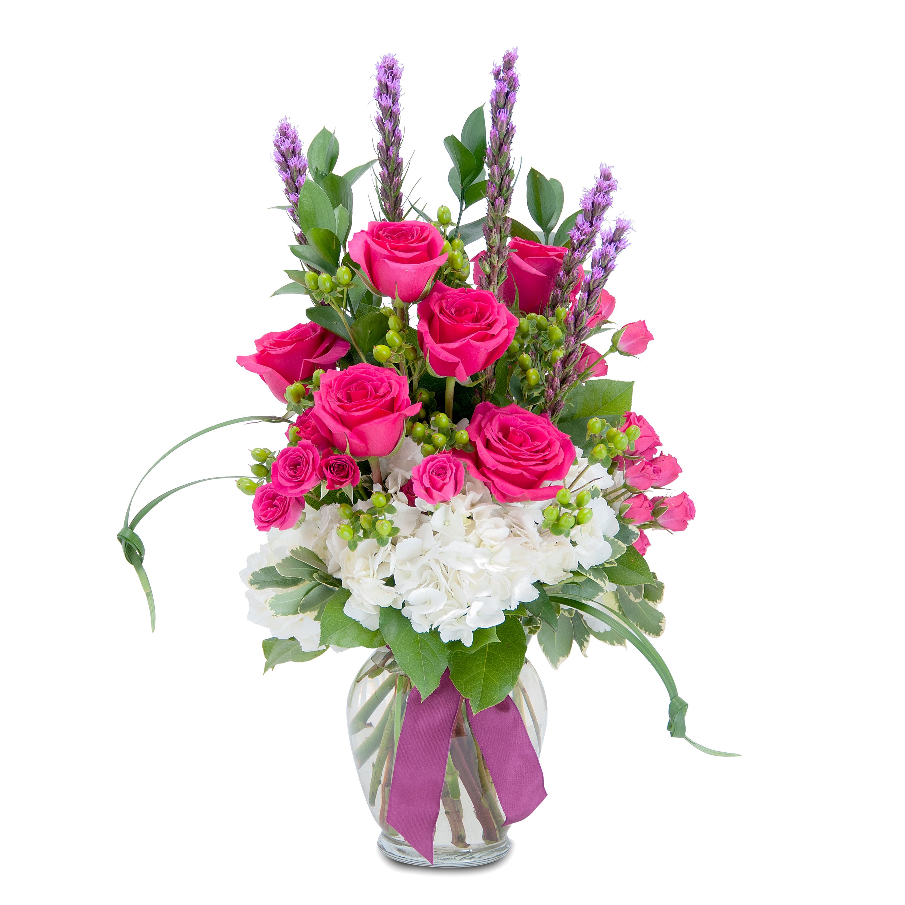 Plentiful Pink - TMF-148A - A bright and bold, plentiful combination of gorgeous pink roses and spray roses, white hydrangea, liatris and assorted foliage. Designed in a clear glass vase and finished with a ribbon tie. Approximately 21&quot;H X 12&quot;W