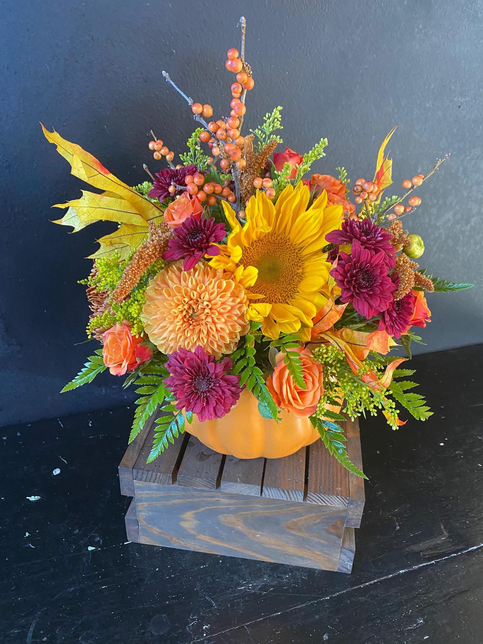 Pumpkin Centerpiece  - Ceramic Pumpkin filled with seasonal fall flowers. Perfect for your Thanksgiving table!