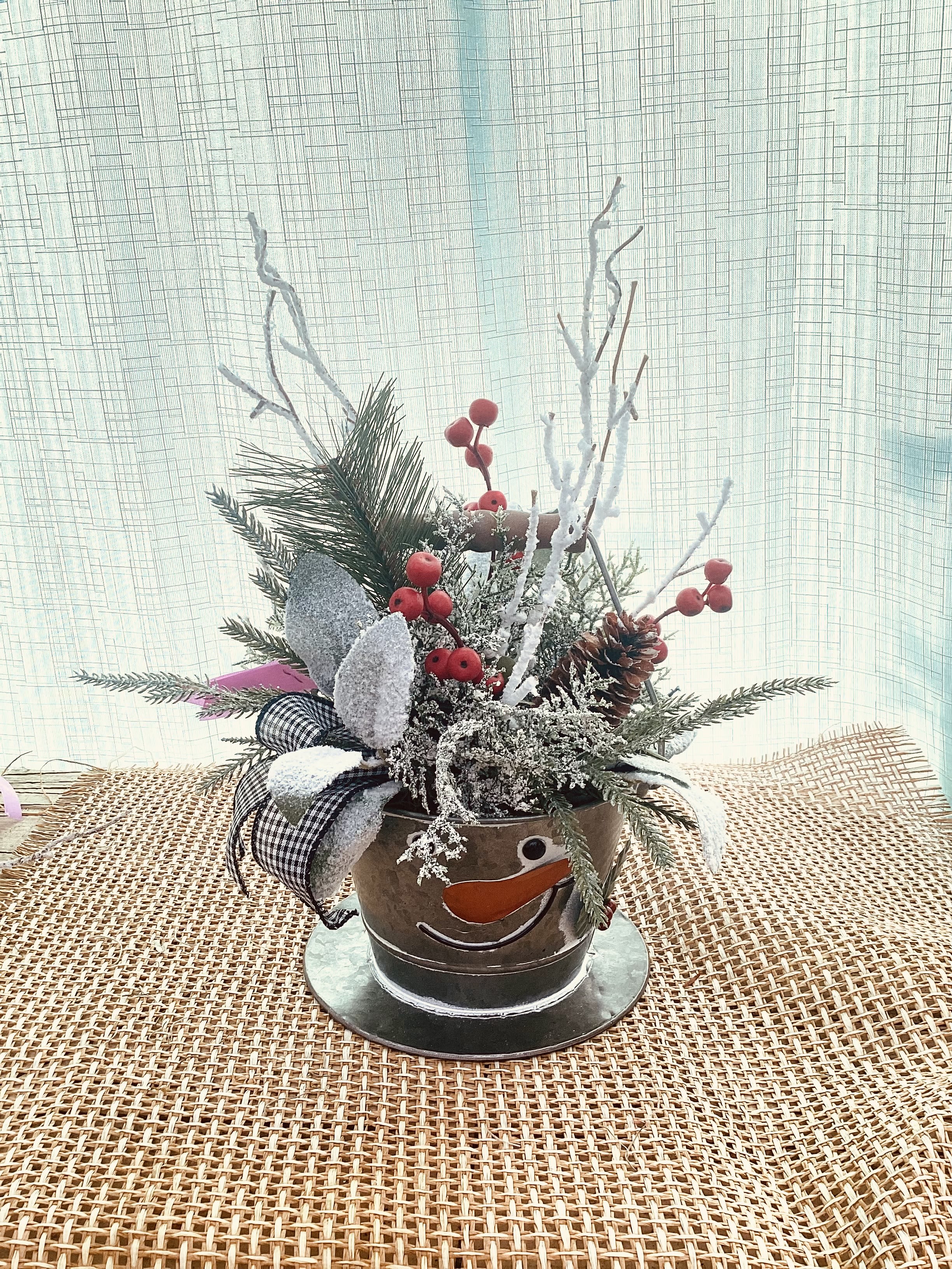 Holiday Snowman Permanent Arrangement  - A holiday arrangement with a snow man top hat vase