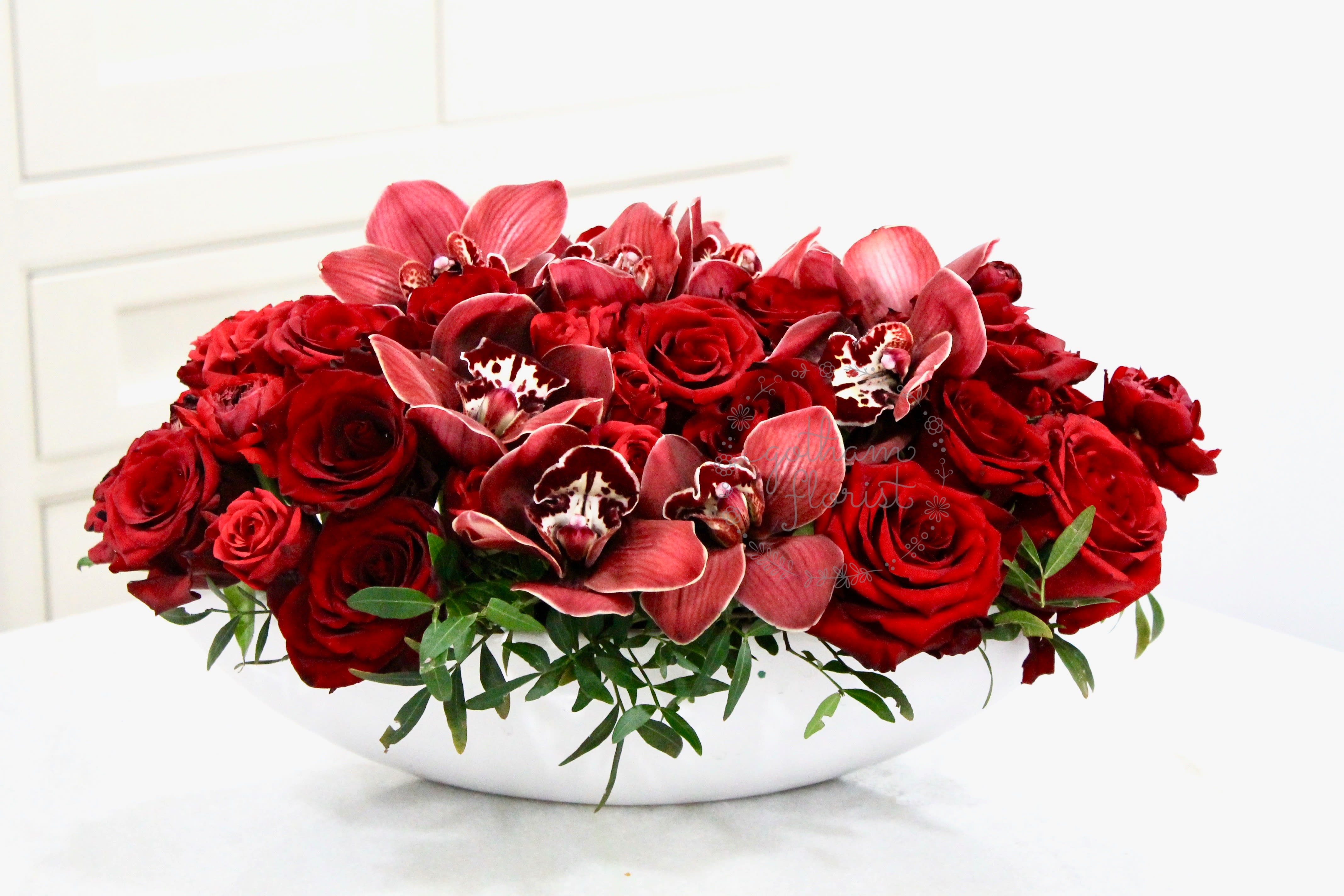 Eternal Flame ( Not available for same day) - 3 dozen roses with orchids. A gorgeous modern design. Send the best flowers from the best florist in New York. Same day delivery available.