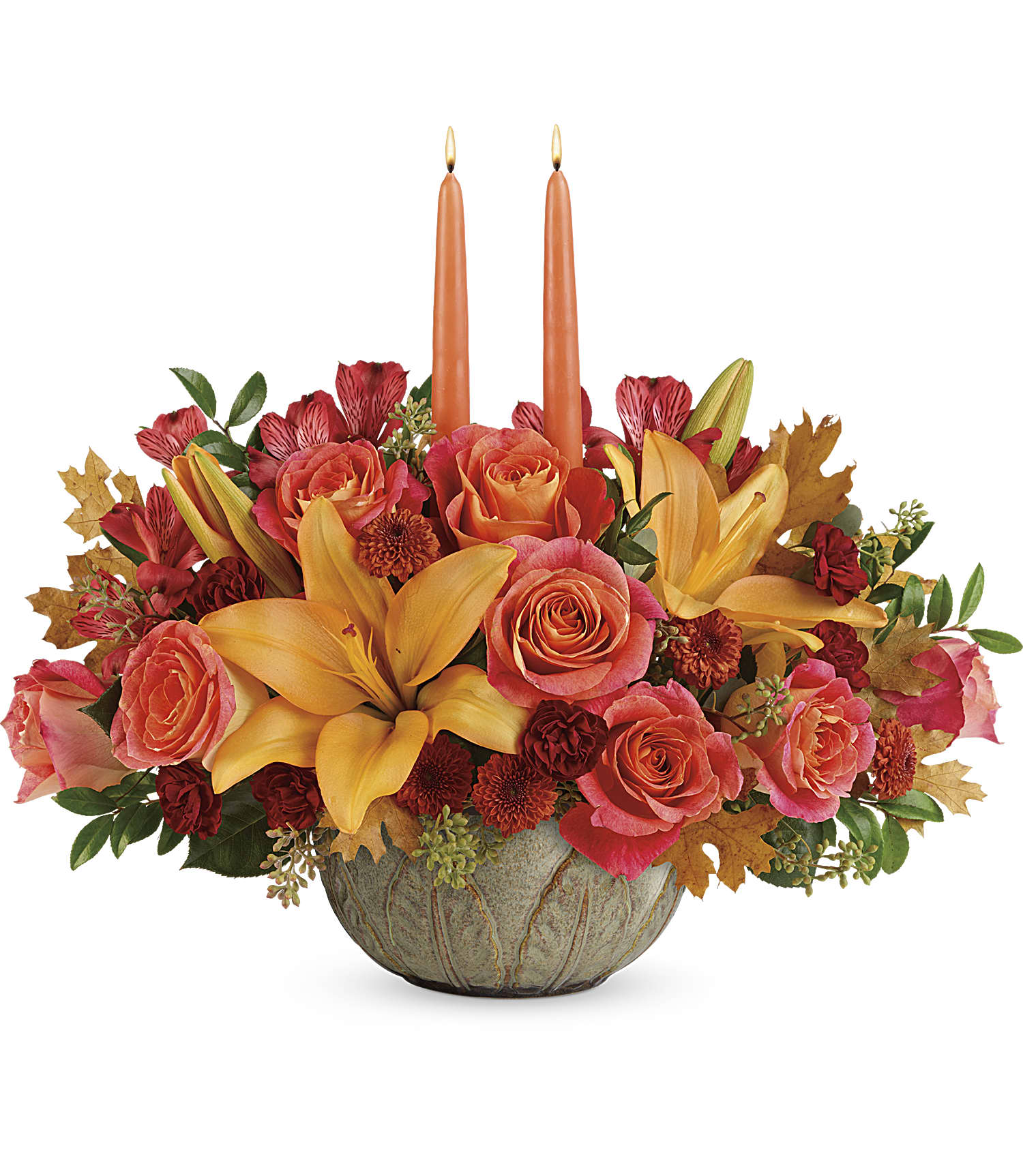 Artistic Glow Centerpiece - Make the season glow with this bright and bountiful fall bouquet of lilies and roses, arranged in a hand-glazed, ceramic stoneware bowl--the perfect mix of pretty and practical!  This glowing arrangement includes orange roses, peach asiatic lilies, red alstroemeria, bronze button spray chrysanthemums, burgundy cushion spray chrysanthemums, seeded eucalyptus, huckleberry, yellow transparent oak leaves, and two candles. Delivered in an Artisanal Autumn Bowl. Approximately 18 1/2&quot; W x 15 1/2&quot; H 