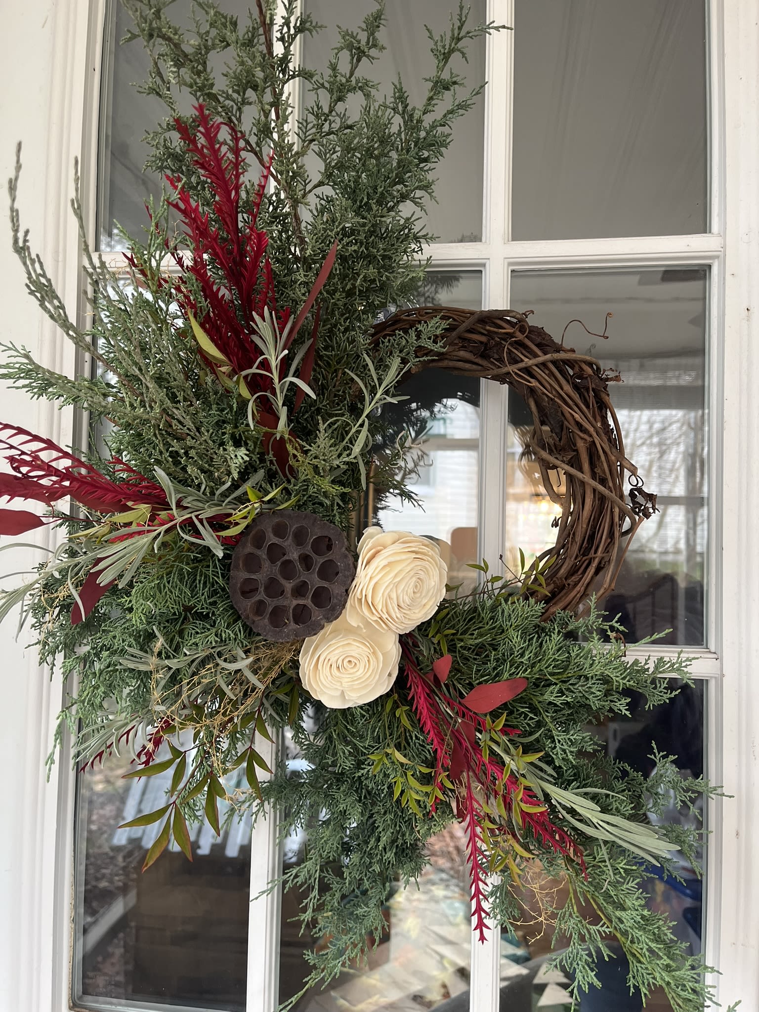 Free Form Wreath - A 10&quot; grapevine wreath with a variety of fresh evergreens, ferns, seed pods, and pinecones ready for the holiday season.  The wreath is approximately 18 inches in height and about 14-16 inches in diameter.  Each wreath is created using the flow of the live materials used making it unique  I begin making Evergreen after Nov. 23rd, please add to the notes or send me an email if you would like glittered elements, colors (blue, bright red, deep red, pink) and the date you want it available.  Thanks!