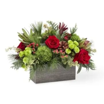 Eckert Florist's FTD Winter Cabin Bouquet - This wonderful Christmas bouquet is handcrafted to bring the cozy feel of the holidays into your home. *Flowers, colors and container will vary