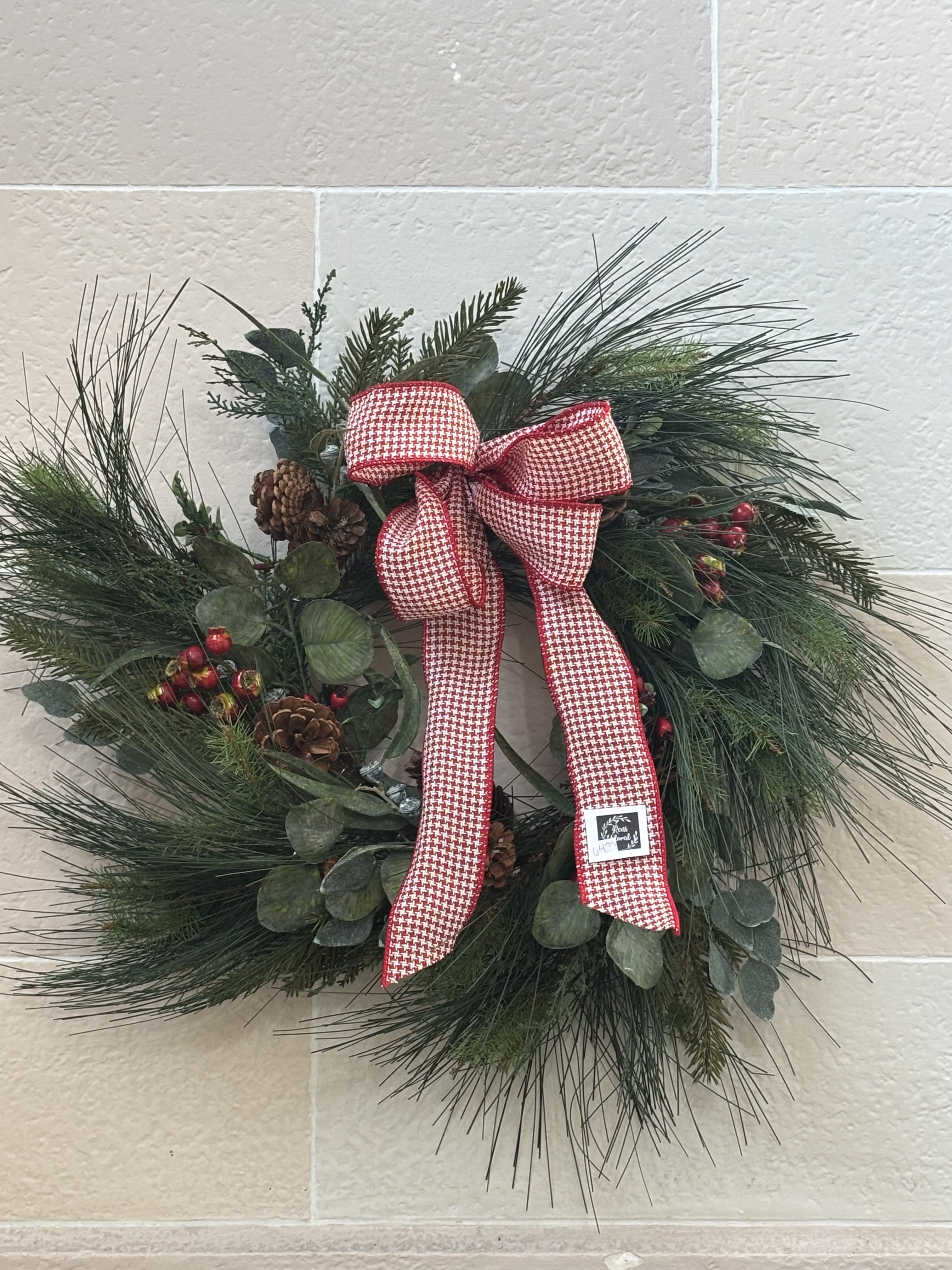 Artificial Long Needle Pine Wreath  - An artificial long needle pine wreath. with berries, pinecones, and a bow. 
