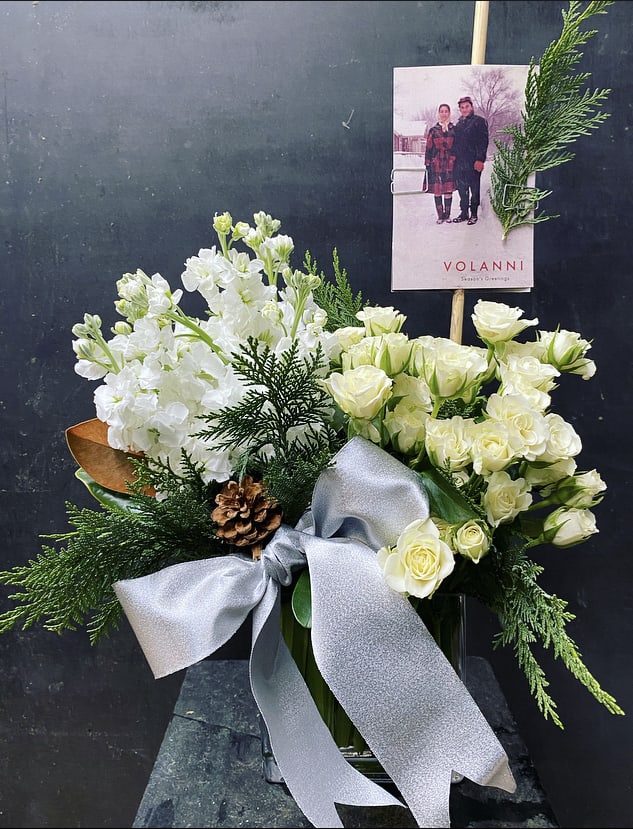 Befana - Garden spray roses, stock, holiday greens and elements.