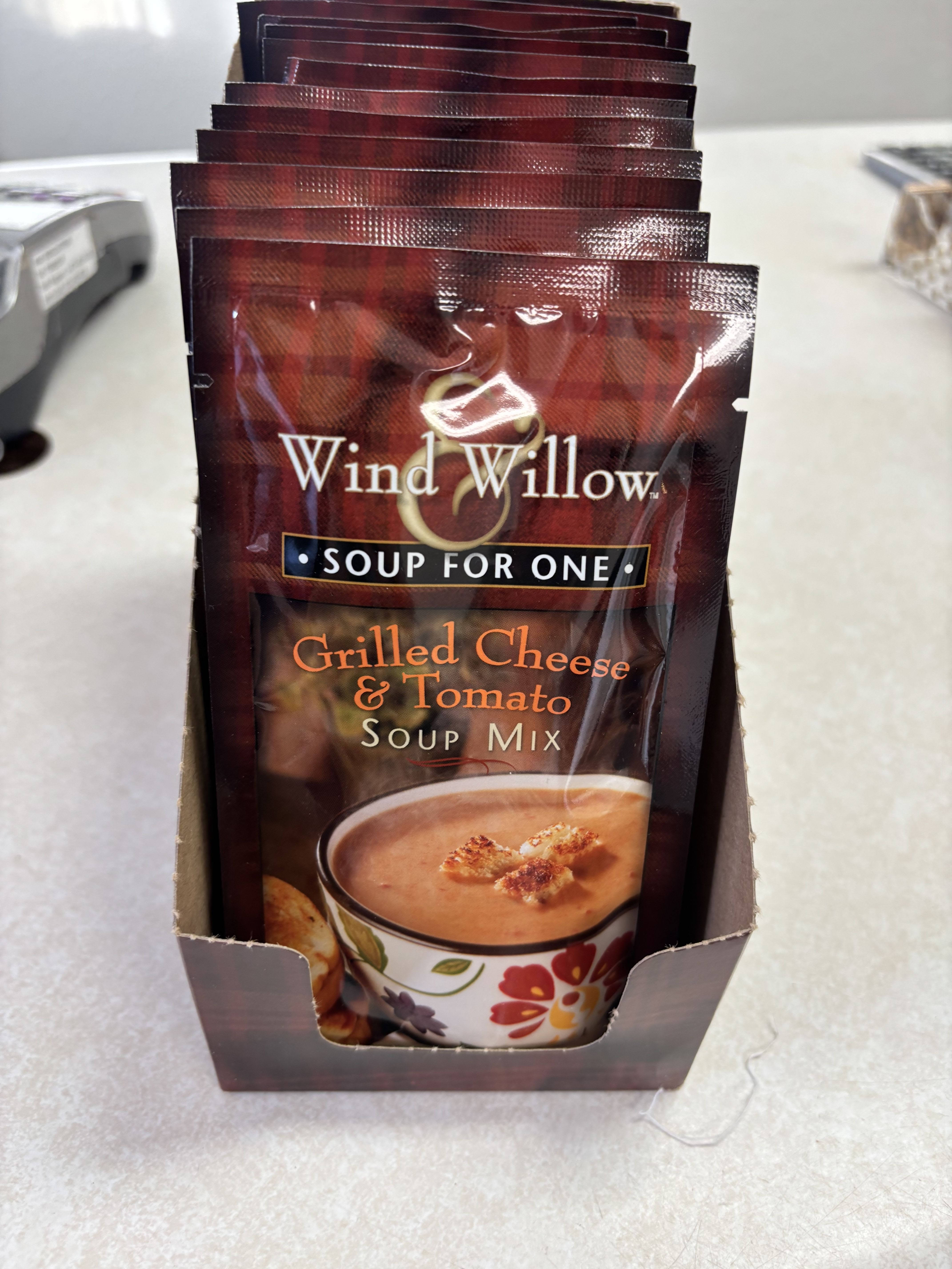 Grilled Cheese &amp; Tomato Soup Mix - Comfort in a cup! Wind &amp; Willow’s Grilled Cheese &amp; Tomato Soup Mix combines the nostalgic flavors of creamy tomato soup and buttery grilled cheese into one cozy, crave-worthy meal. Rich, smooth tomato blends with hints of cheddar and toasted bread notes for a perfectly balanced, heartwarming experience.  Just add water, heat, and enjoy — no need for a full kitchen or long prep time. Perfect for lunch at work, a quick dinner, or a comforting treat on a chilly day.