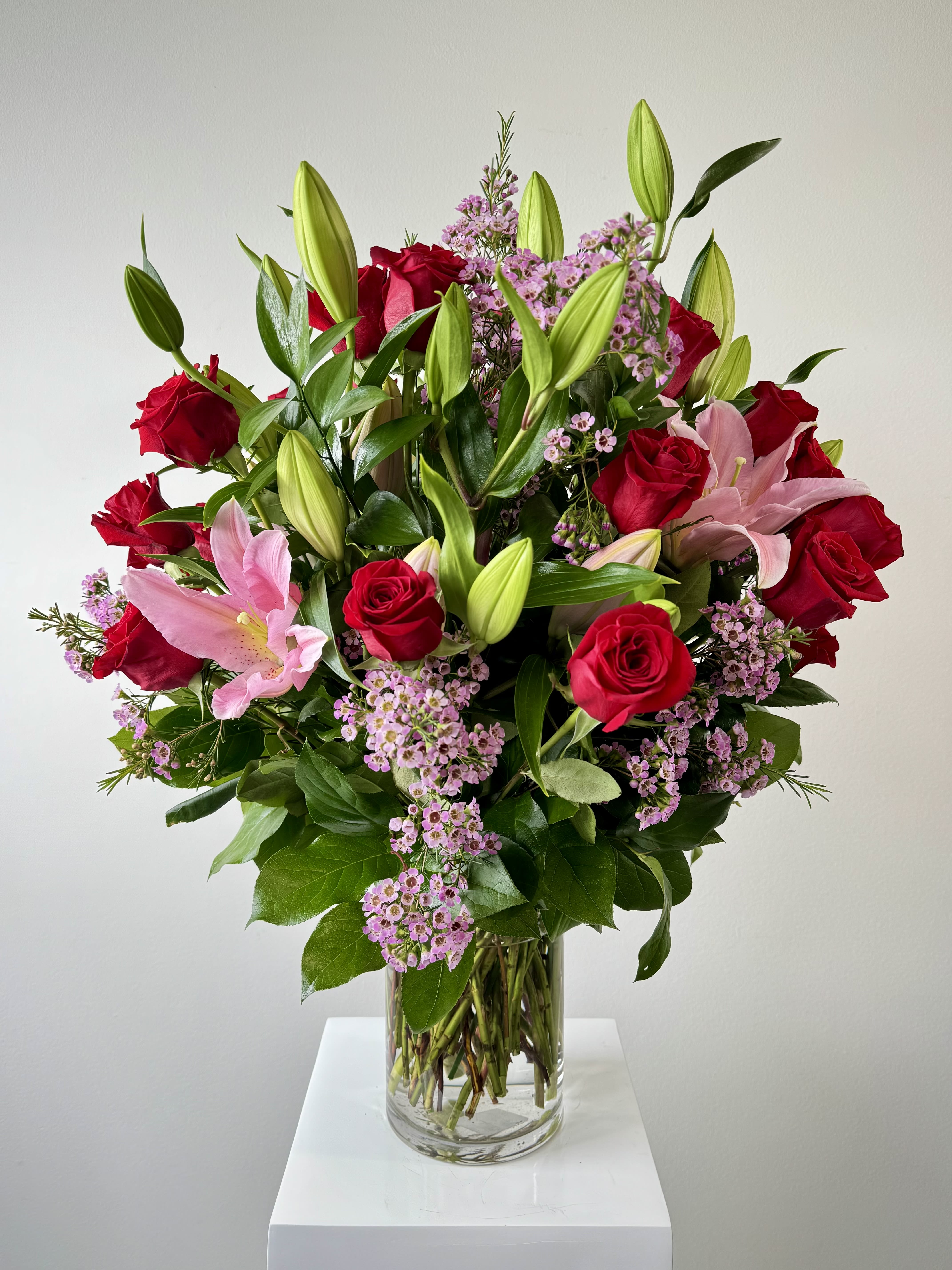 For you Sweetheart - Ignite passion with the For You Sweetheart arrangement – a luxurious bouquet of two dozen red roses, fragrant pink lilies, and delicate wax flowers. This timeless romantic gesture screams “I love you” in vibrant blooms, perfect for anniversaries, Valentine’s Day, or spontaneous declarations of devotion.  Why the For You Sweetheart Bouquet Stands Out: Arranged carefully with 24 premium red roses symbolizing deep love and desire, accented by soft pink lilies for admiration and elegance, and finished with airy wax flowers adding texture and sweetness. Arrives in a chic glass ready to sweep your sweetheart off their feet.  Flower Symbolism &amp; Details: Two Dozen Red Roses: 24 velvety blooms = unwavering commitment and true romance. Pink Lilies: Graceful trumpet-shaped flowers; express prosperity and feminine charm. Wax Flowers: Tiny star-shaped clusters; represent lasting love and good luck.  For Romance Seekers Searching for you sweetheart roses, two dozen red rose bouquet, pink lily valentine flowers, red roses with wax flower delivery, or romantic anniversary arrangement? This For You Sweetheart bouquet ranks high for luxury rose gifts, same-day flower delivery, and Valentine’s Day red roses. Expertly arranged with farm-fresh stems for many days of beauty.