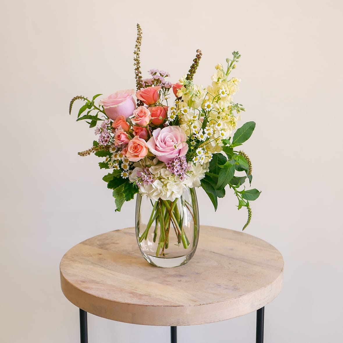 My Darling - This enchanting arrangement features a soft colorful palette of roses, stock, hydrangeas, chamomile and more, beautifully presented in a glass vase. Perfect for bringing a touch of seasonal charm and delicate elegance to brighten someone's day. Arrangement will be delivered approximately as pictured, about 15 inches tall with flowers.