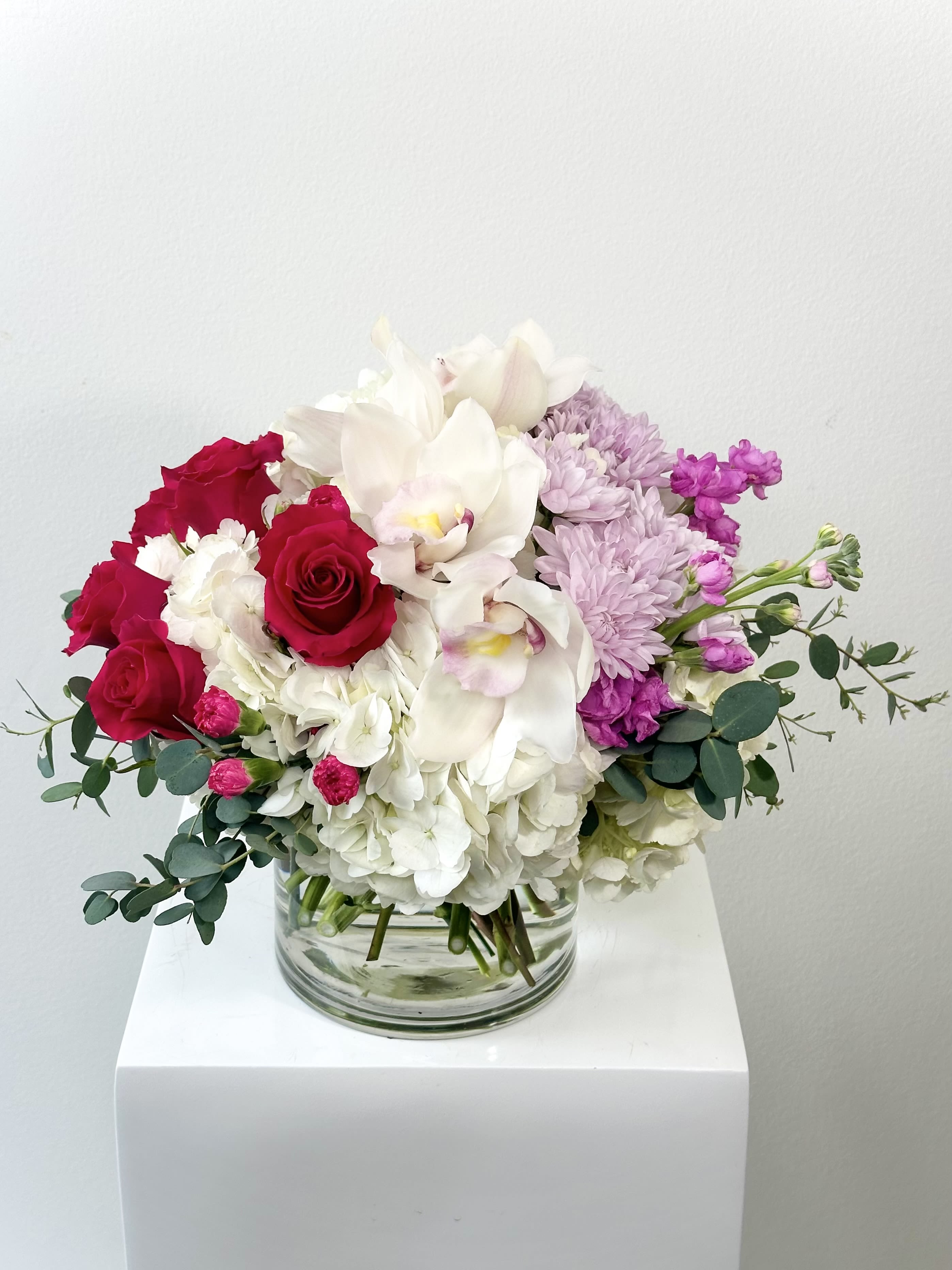 Fruit Punch - Fruit Punch Flower Arrangement – Fuchsia Roses &amp; White Hydrangea Bouquet: Ignite joy with Fruit Punch: a bold mix of fuchsia roses, hot pink carnations, white hydrangea, white cymbidium orchids, purple chrysanthemums, purple stock, and aromatic eucalyptus. This vibrant, tropical-inspired bouquet bursts with color and fragrance—ideal for birthdays, celebrations, thank-yous, or statement décor. Delivered in a modern glass vase.  Why Fruit Punch Pops: Fuchsia Roses: Passion, excitement Hot Pink Carnations: Admiration, fun White Hydrangea: Gratitude, abundance White Cymbidium Orchids: Luxury, elegance Purple Chrysanthemums: Longevity, joy Purple Stock: Lasting beauty Eucalyptus: Freshness, protection  Search fruit punch flowers, fuchsia roses hot pink carnation bouquet, white hydrangea cymbidium orchids, purple chrysanthemum stock eucalyptus, or vibrant tropical arrangement? Fruit Punch ranks #1 for birthday bold bouquets, same-day colorful delivery, celebration floral gifts, and jewel-tone designer flowers. Order Fruit Punch now – ultimate vibrant fuchsia purple bouquet for parties, gifts, or instant wow. Search fruit punch near me! Keywords: fruit punch arrangement, fuchsia roses carnations, white hydrangea orchids, purple stock eucalyptus, bold flower delivery