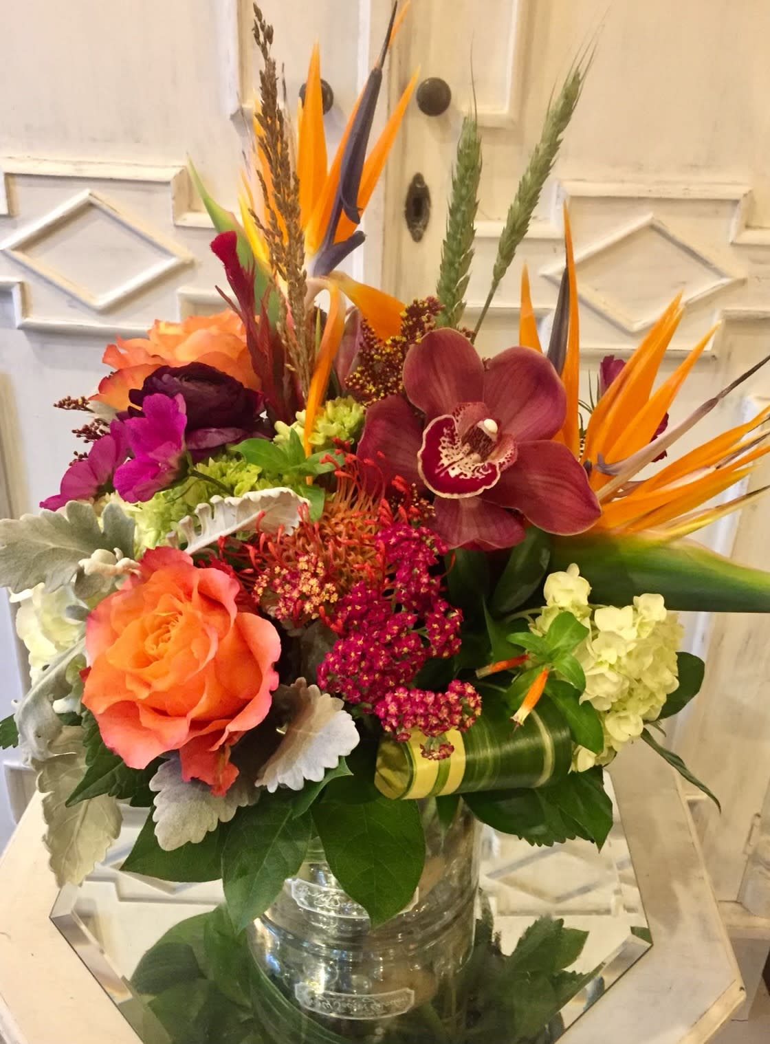 Thanksgiving Distinction  - Show how thankful and grateful you are for those special to you with this stunning bouquet! This includes Bird of Paradise, Cymbidium Orchids, Roses, feathers and an array of other unusual flowers. 