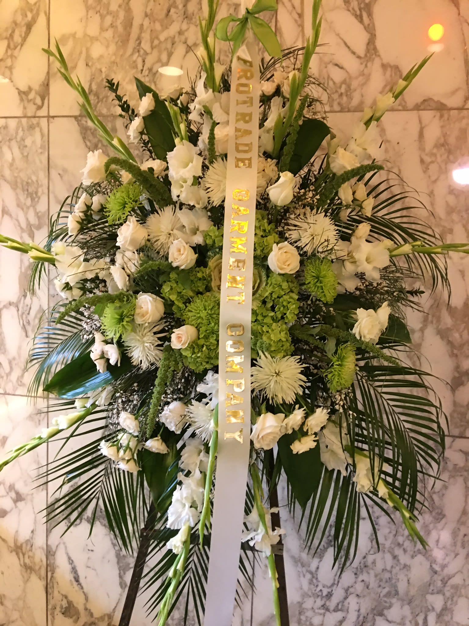 Green forest  standing spray  - This two colors together design with greens and whites  selected premium roses and greenery’s will make you memorable  