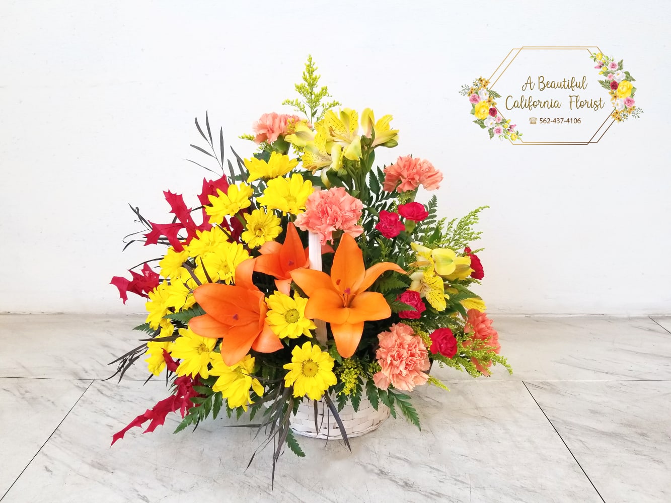 Autumn's Wonder Basket - Autumn's Wonder, a beautiful arrangement of Fall blooms, foliage and textures. Presented in wicker basket. Perfect for sending good wishes for Autumn Birthday's, Get Well, Thanksgiving or Just Because. Another exclusive Fall flower arrangement from Long Beach favorite five 5 star flower shop with same day delivery. A Beautiful California Florist, serving Long Beach for 80 plus years! Approximate size: 14&quot; T X 16&quot; W