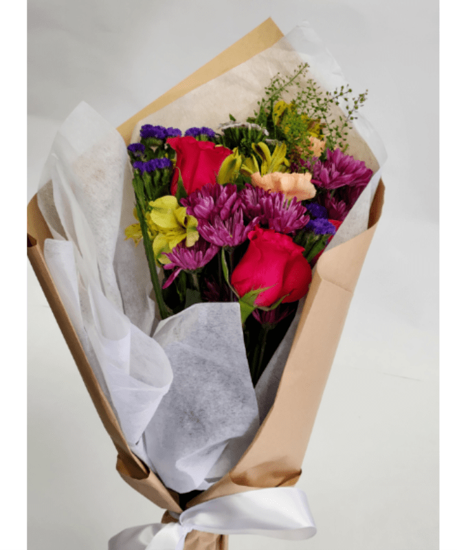 Hand Wrapped Bouquet - A Hand wrapped bouquet that changes with the seasons. 