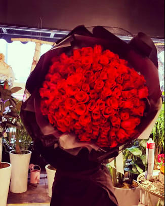 SG - 49 - Love is Metaphysical gravity! Giant Presentable bouquet of Premium Roses.  If you want this arrangement in a vase or a container, please leave a note for our florists. Colors are options as well.