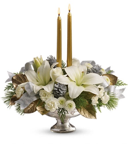 Teleflora's Silver And Gold Centerpiece - by Camile's Flowers &amp; Gifts - Inspired by the magic of the first snow this elegant centerpiece of pure white lilies and winter greens arranged in a stunning mercury glass bowl makes a fresh fragrant addition to your holiday table or a breathtaking gift for someone special. This stunning arrangement includes white roses white asiatic lilies white miniature carnations white button chrysanthemums flat cedar white pine and lemon leaf accented with small silver pinecones gold taper candles and silver ribbon. Delivered in an exclusive Mercury Glass bowl. Approximately 16&quot; W x 16&quot; H Orientation: All-Around As Shown : TWR09-1ADeluxe : TWR09-1BPremium : TWR09-1C
