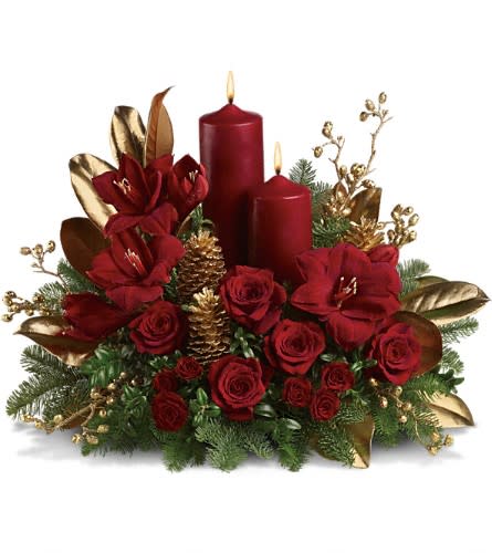 Candlelit Christmas - Christmas by candlelight is the perfect way to delight in the warmth and joy of the season. This elegant arrangement will be at home anywhere in the house adding grace and beauty to any holiday celebration. Ruby red amaryllis roses and spray roses are perfectly arranged with golden pinecones and holiday greenery. Two pillar candles in a stunning shade of pomegranate are the perfect touch to light up the night.Approximately 23&quot; W x 18&quot; H Orientation: All-Around As Shown : T113-1ADeluxe : T113-1BPremium : T113-1C