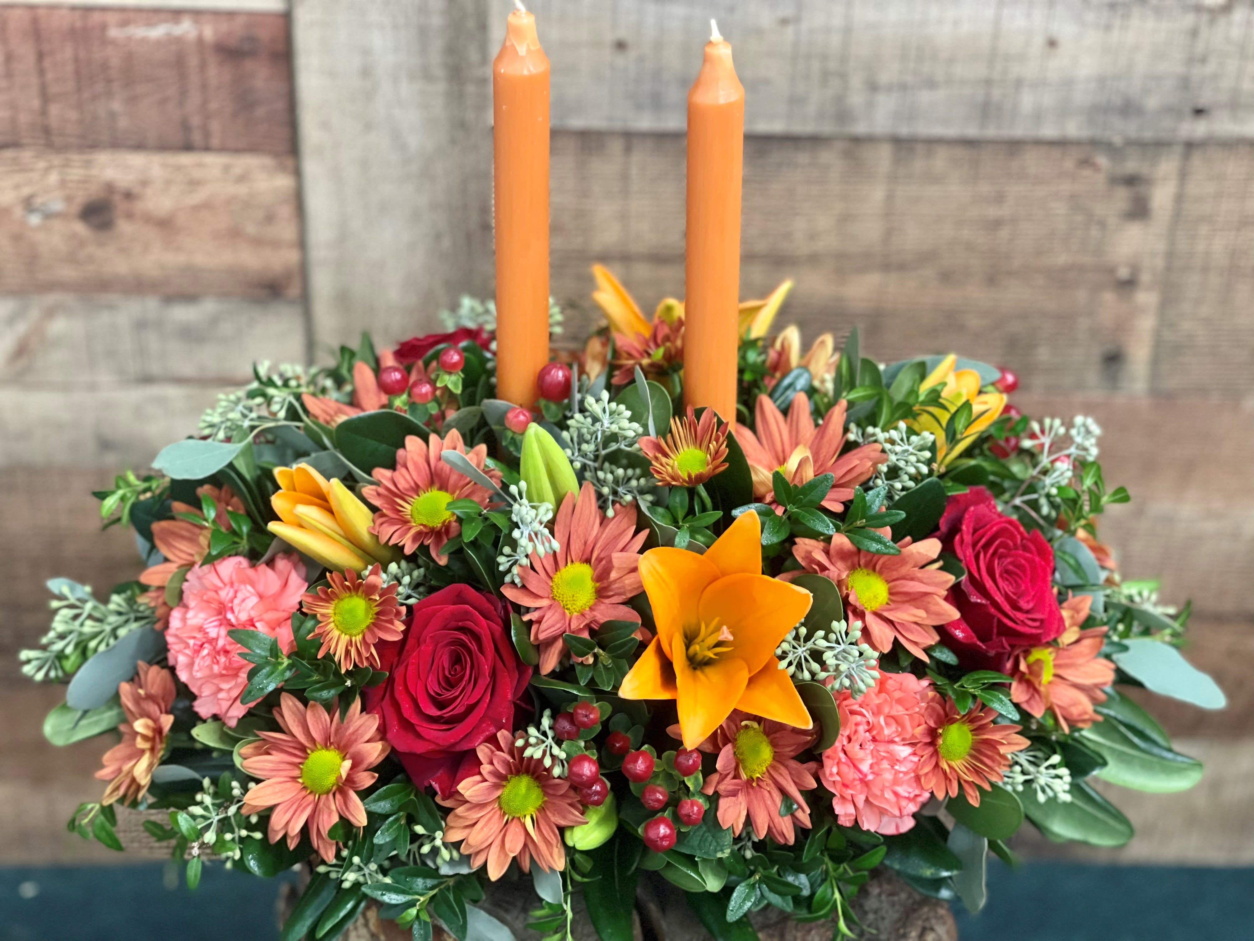 Autumn Treasures Centerpeice - This traditional style double candle centerpiece is beautifully designed in a an oblong fashion making sure to accommodate all those extra guests. 