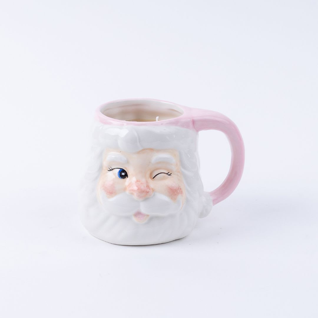 Santa mug - Meet your new favorite holiday companion: the Sweet Grace Santa Mug Candle! With its adorable pink and white Santa face, this candle brings festive cheer and the irresistible scent of Sweet Grace, lasting for up to 45 hours. And here's the fun part: once the candle is gone, it transforms into a whimsical mug, making it the ultimate two-for-one gift that keeps the holiday smiles coming! Choose deluxe to add a floral arrangement to this special gift.