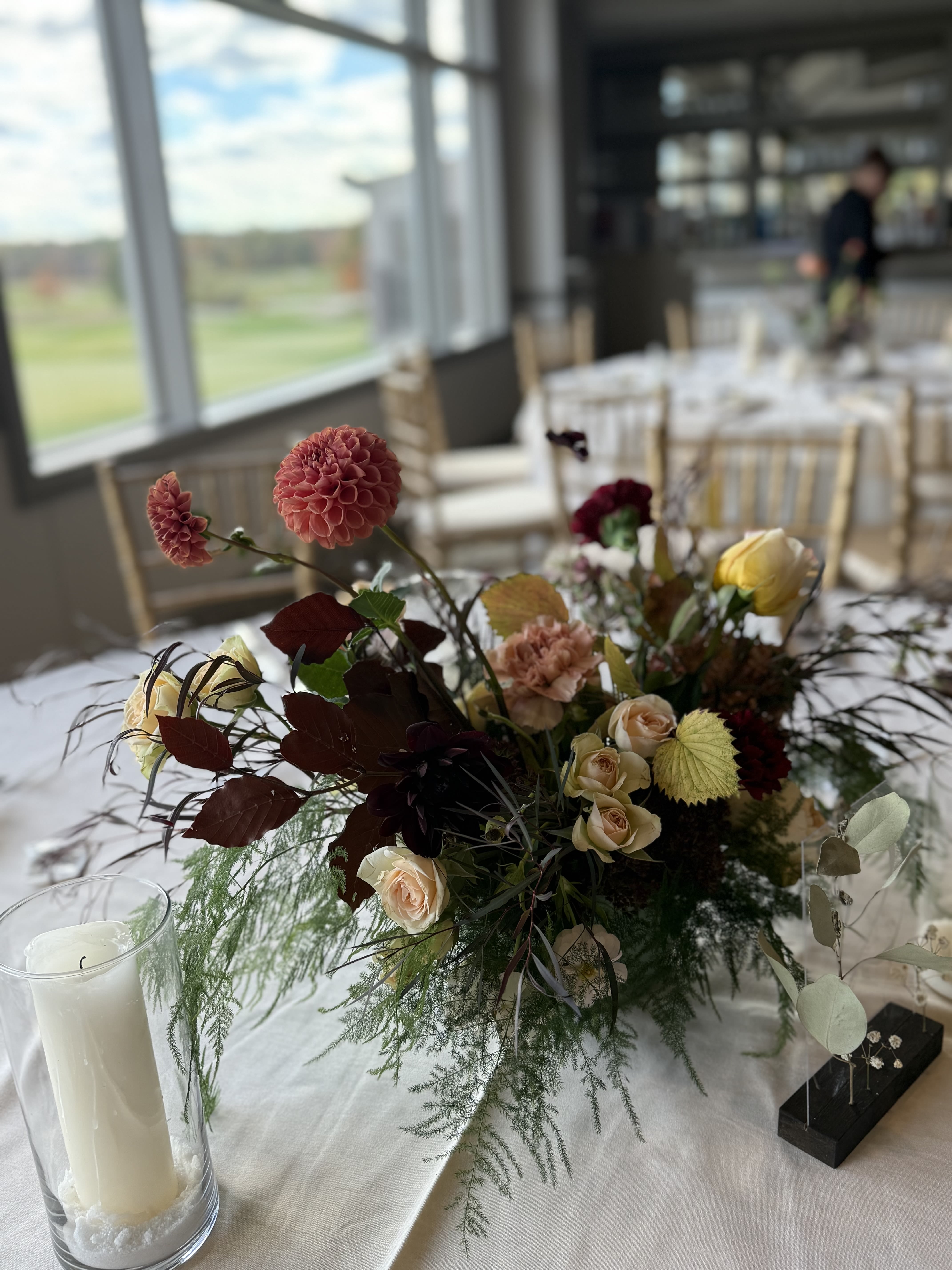 Thanksgiving Centerpiece - Bring the beauty of the season to your table with a one-of-a-kind Thanksgiving centerpiece, thoughtfully arranged us. Each piece is unique and designed in rich autumnal hues- think golden yellows, burnt orange, deep burgundy, and soft earthy tones. Perfectly sized and styled for your holiday table, these arrangements capture the warmth and abundance of fall.  Every centerpiece is florist’s choice, ensuring a fresh, creative design made with the best blooms available. If you have a particular color palette in mind, please let us know before checkout- we’re happy to create something that complements your celebration perfectly.