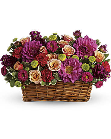 Burst of Beauty Bouquet -  Color outside the lines with this incredible basket of summer flowers! Pops of hot pink, pale orange, deep purple and bright green spill over the sides of a rectangular basket. It's an exciting, heartfelt gesture to send a stylish friend, a colorful girlfriend or anyone who needs perking up.      Hot pink flowers - dahlias, matsumoto asters and carnations - are arranged with pale orange roses, purple stock and bright green button mums in a natural rectangular basket.