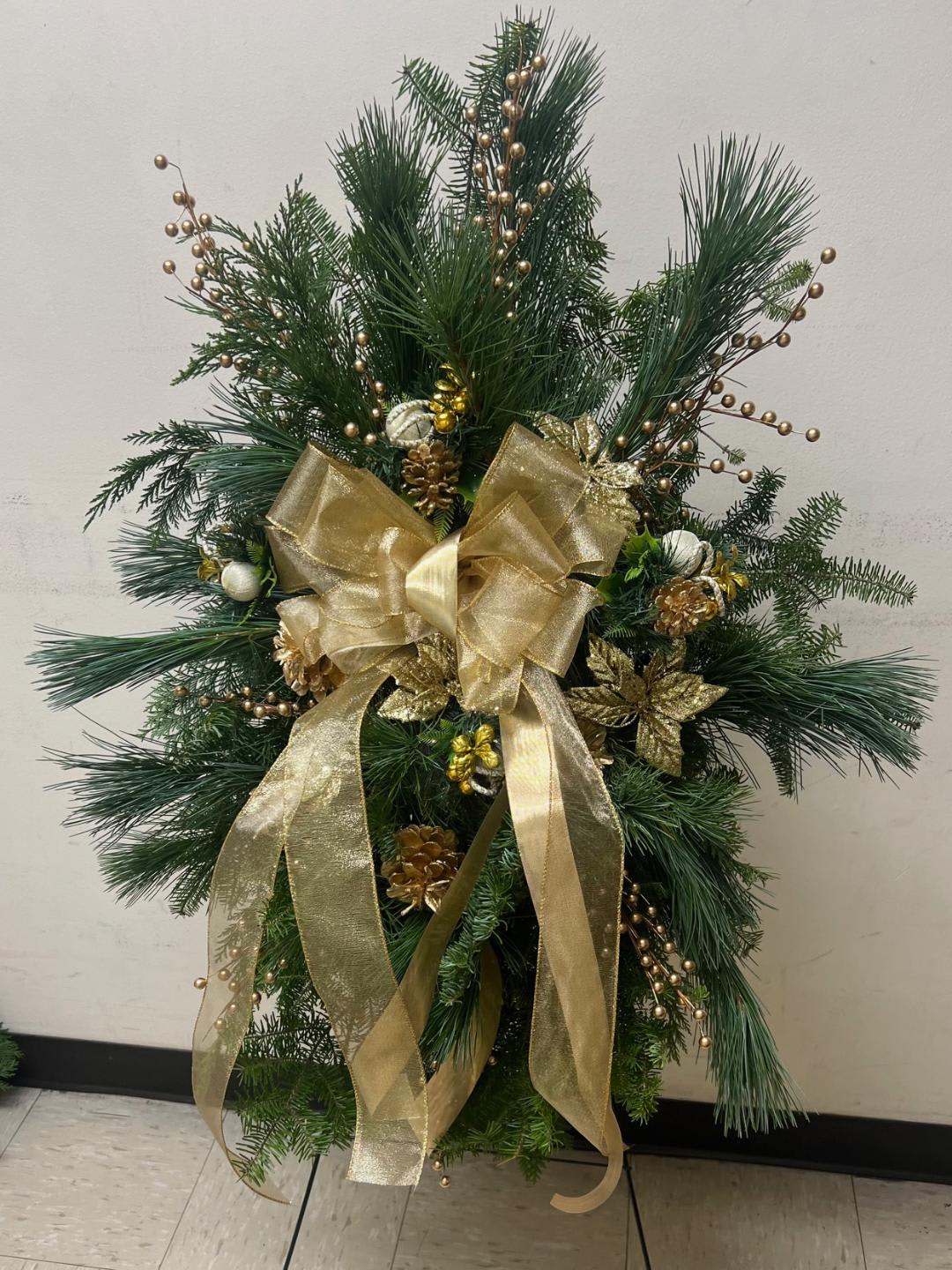 [TT-GOLDXS]:  GOLD EVERGREEN SWAG ON EASEL - GOLD EVERGREEN SWAG ON EASEL BY TWIN TOWERS FLORIST 