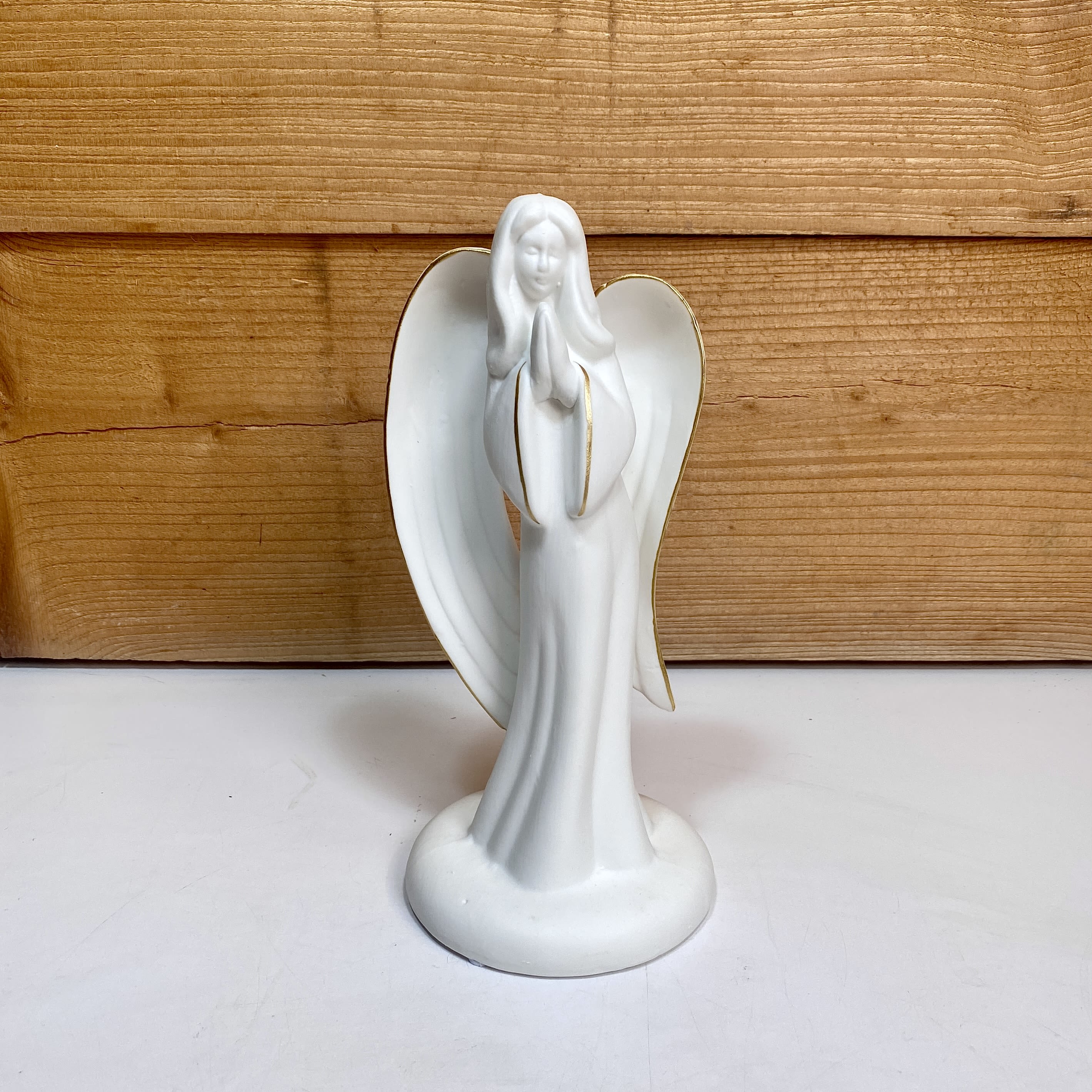 Ceramic Gold Edge Angel - Get this beautiful, unglazed ceramic angel with golden edges for the person in your life that needs it the most. Dimensions: W 4.5” x H 9”