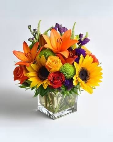 Color Me Cozy - A warm and whimsical bouquet filled with autumn tones and playful textures — perfect for sweater weather days.