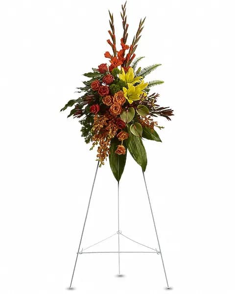Tropical Tribute Spray - Tropical highlights balance with lush earth tones to offer hope and encourage reflection - a vivid spray that expresses deep and generous tribute. A breathtaking assortment of flowers such as yellow asiatic lilies with orange orchids and roses, red gladioli and protea, and yellow chrysanthemums, delivered on an easel.