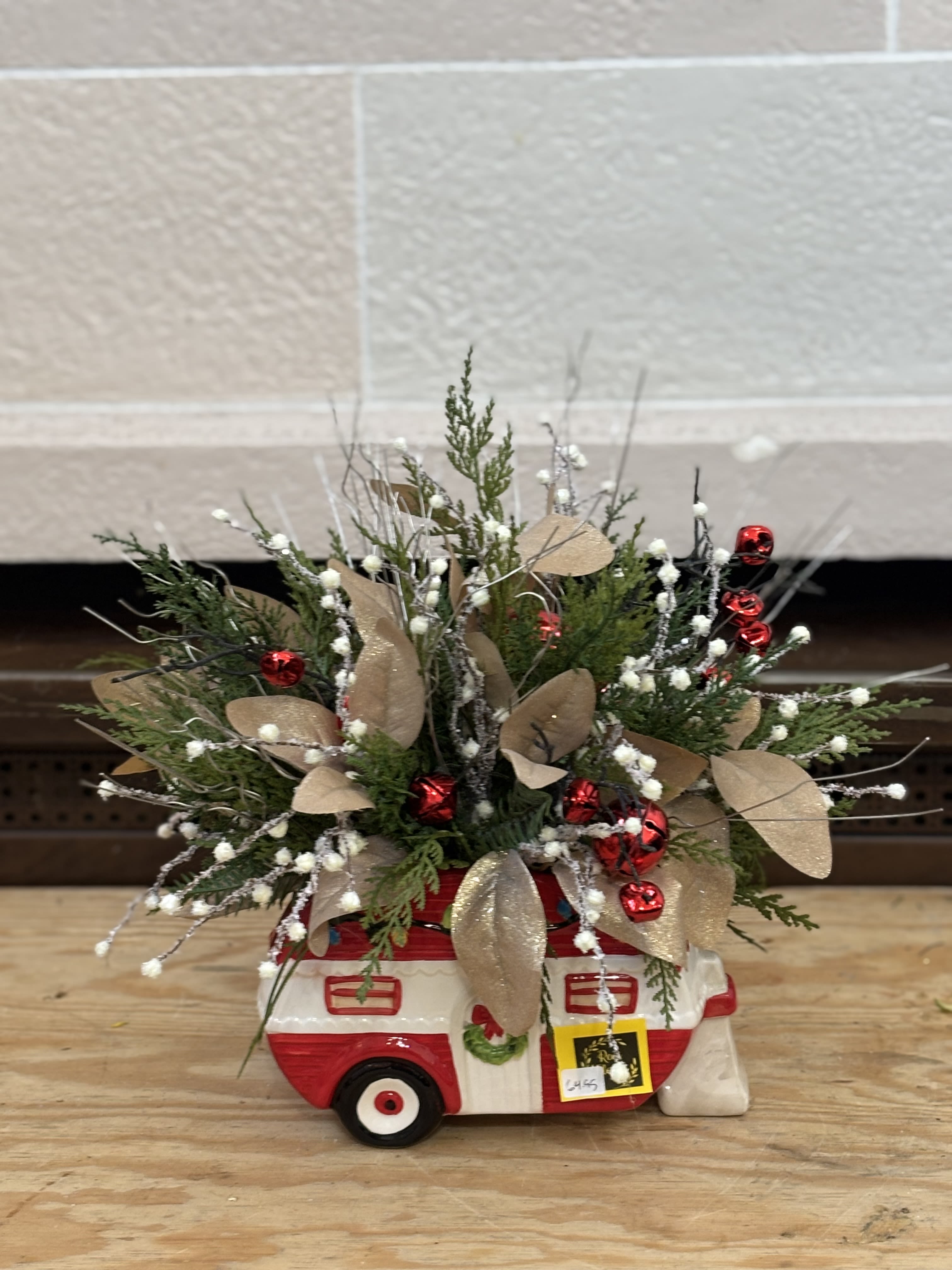 Camper Artifical  - An artificial arrangement in a camper planter. 