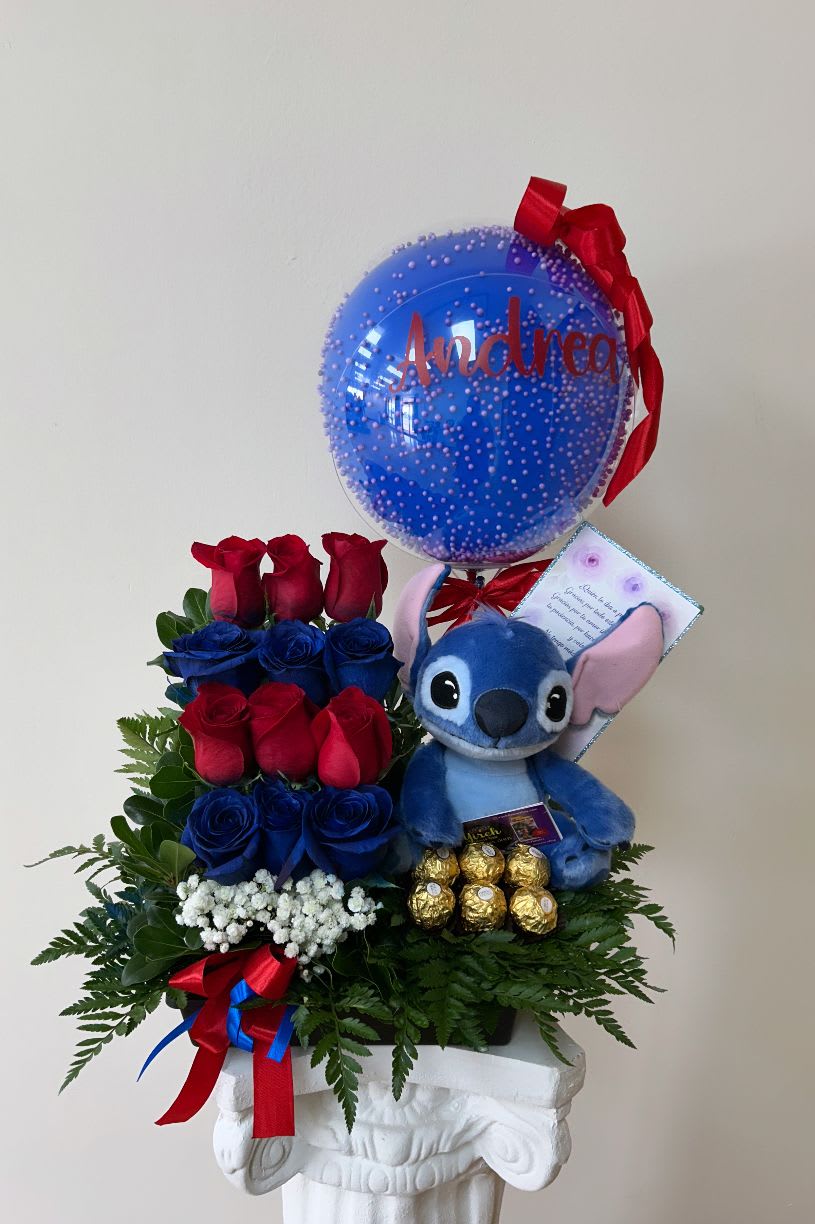 Red &amp; blue roses - This beautiful arrangement is composed of fresh red roses that symbolize love and dedication, accompanied by exquisite Ferrero Rocher chocolates, wrapped in their bright gold that brings a touch of luxury and elegance.