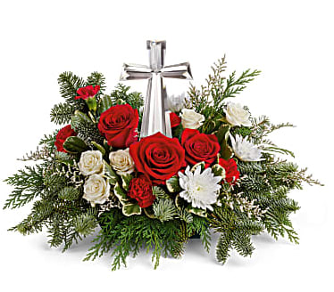 Teleflora's Joy Of Light Bouquet - The crystal cross is nestled elegantly among red and white blooms, this keepsake brings joy and light to your special occasion. Red roses, white spray roses, red miniature carnations, white cushion spray chrysanthemums are adorned with white limonium, varigated pittosporum, noble fir, and cedar. Delivered with Teleflora's Crystal Cross Keepsake. Orientation: One-Sided