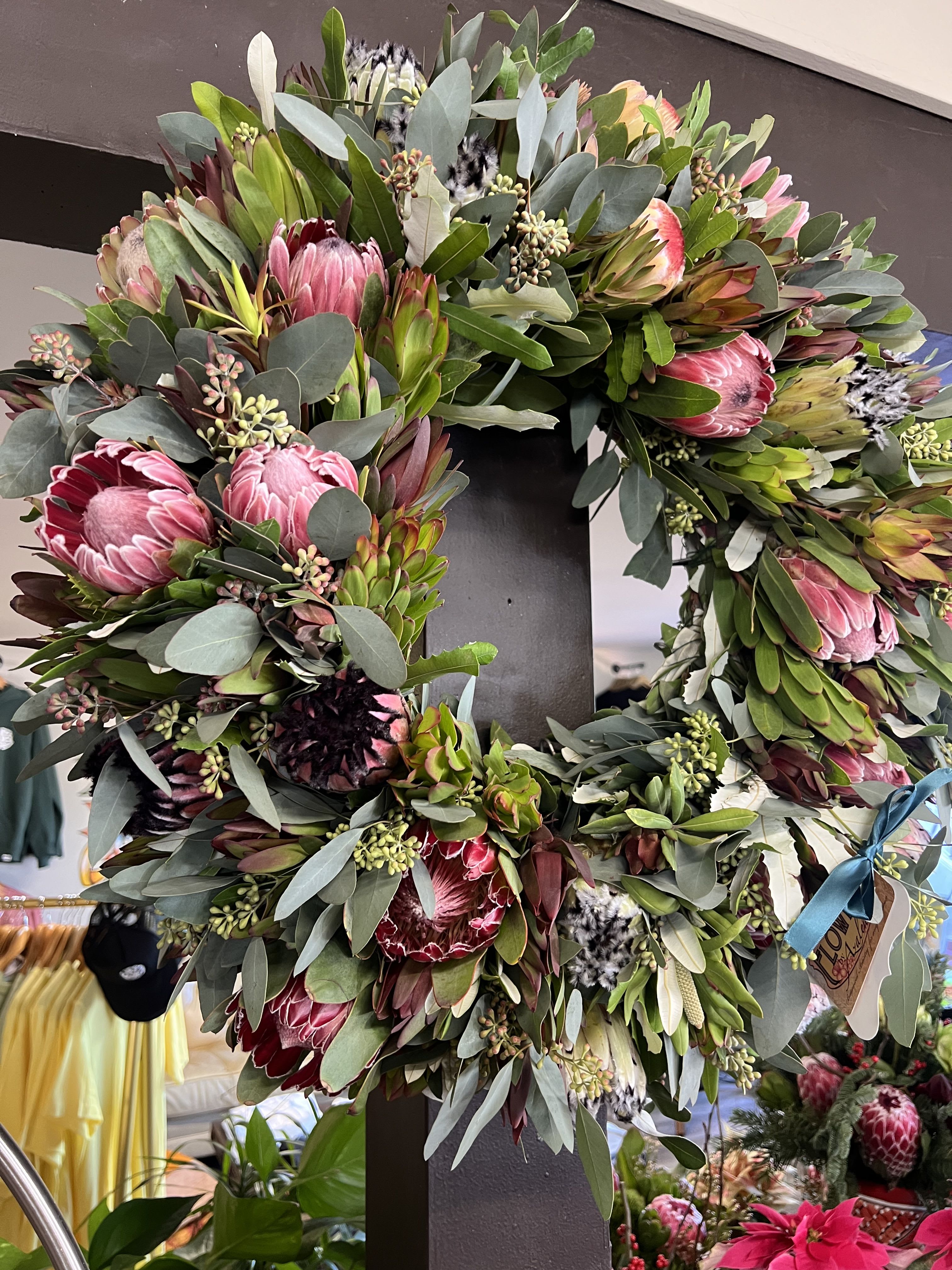 No Basics Please - A beautiful assortment of Pink Protea and some stand out Banksia! All in one wreath! (approximately 22 inches in diameter)  Please allow 3-5 days for your order to be processed. Tues - Fri delivery ONLY!