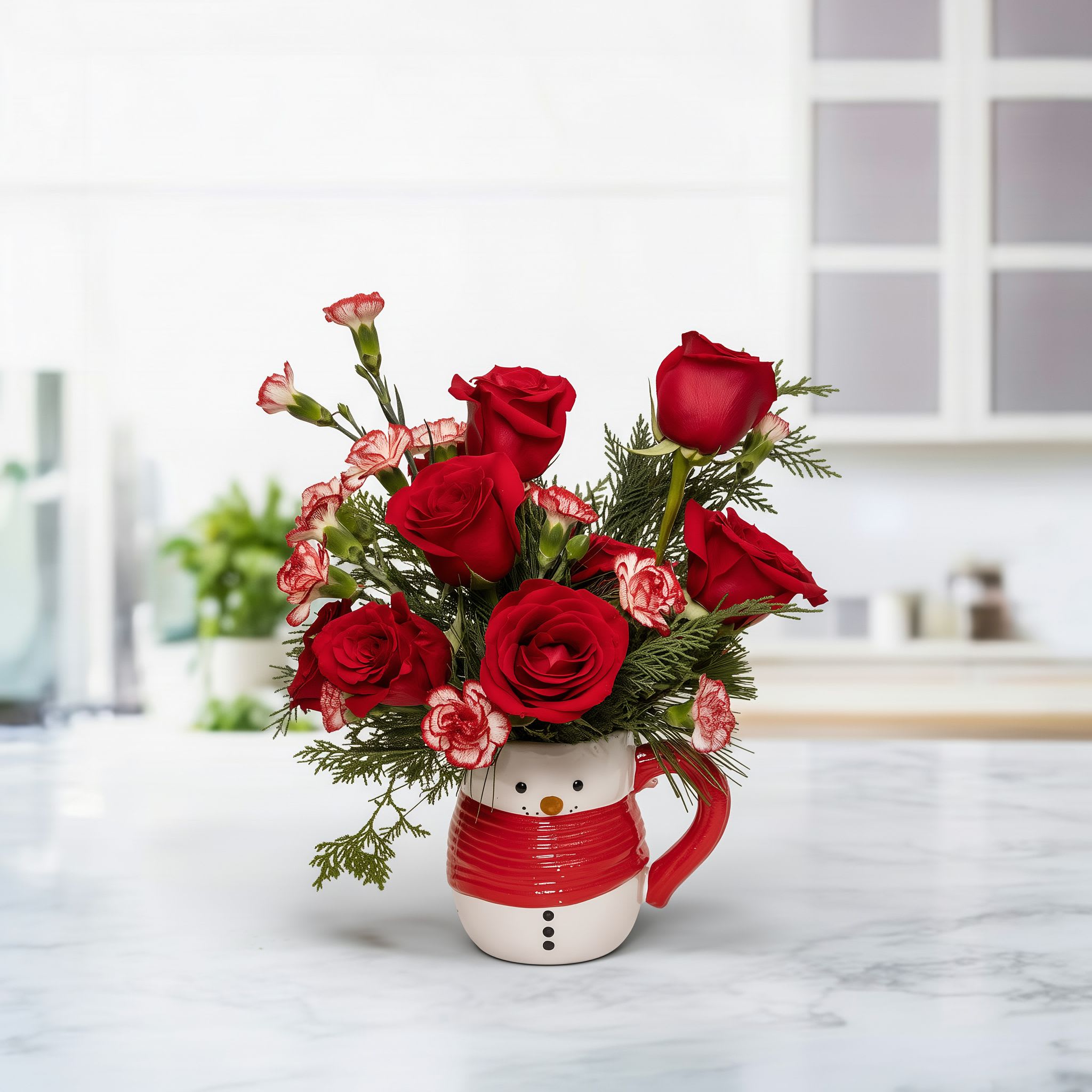 Merry Mug Floral Design - Merry Mug Floral Design is a charming Christmas flower arrangement created in a festive holiday mug, perfect for gifting or decorating any cozy space. This Christmas floral arrangement features fresh seasonal blooms, winter greenery, holiday accents, and vibrant colors that bring warmth, joy, and Christmas spirit to every home. Ideal as a holiday gift, office decoration, or Christmas centerpiece, this unique floral mug adds a cheerful touch to any celebration.