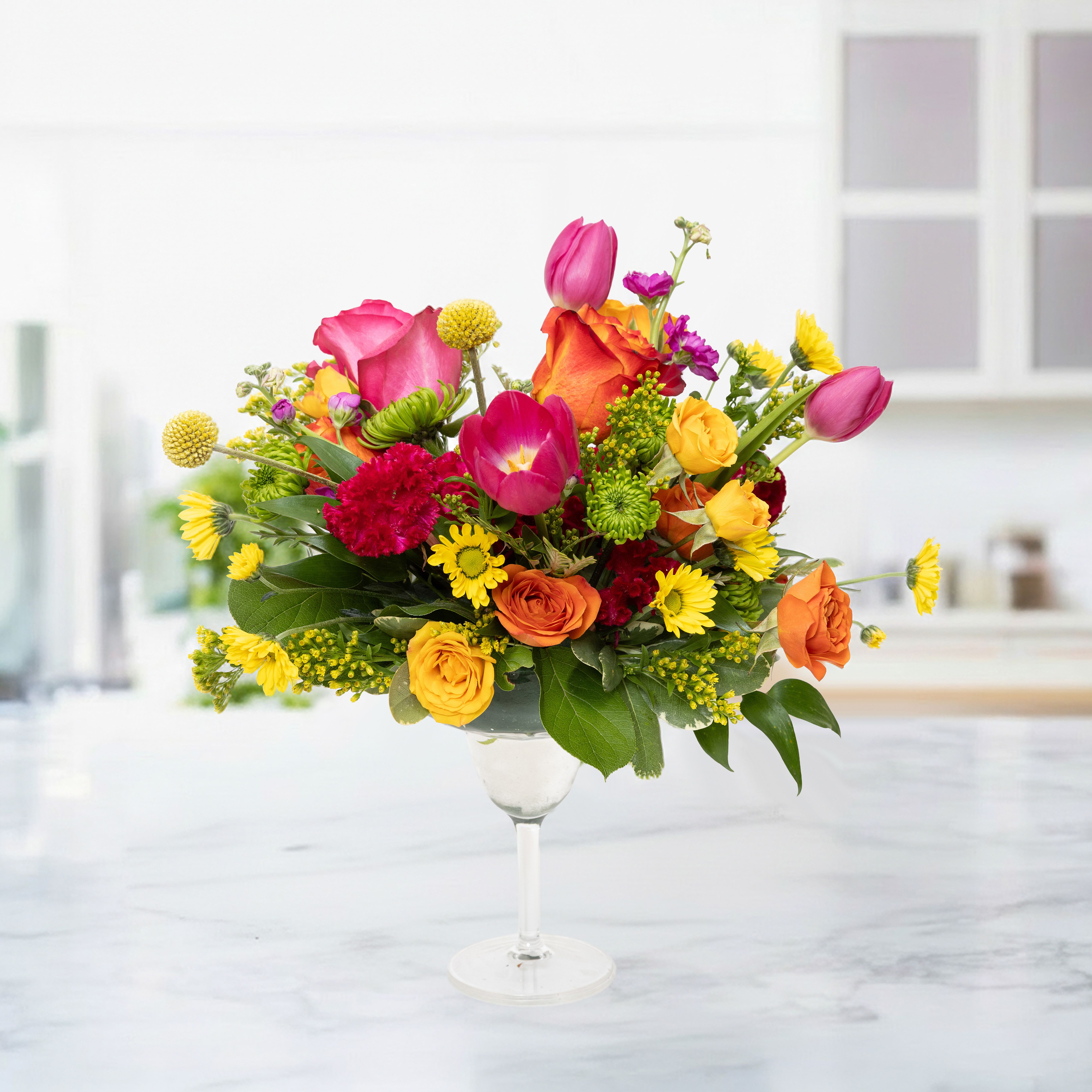 Floral Cheers - Floral Cheers is a delightful birthday flower arrangement beautifully presented in a stylish glass cup. Featuring vibrant seasonal blooms, lush greenery, and carefully selected flowers, this unique bouquet brings joy, color, and celebration to any special occasion. Perfect for birthdays, anniversaries, congratulations, or simply brightening someone’s day, Floral Cheers is a charming and memorable floral gift.
