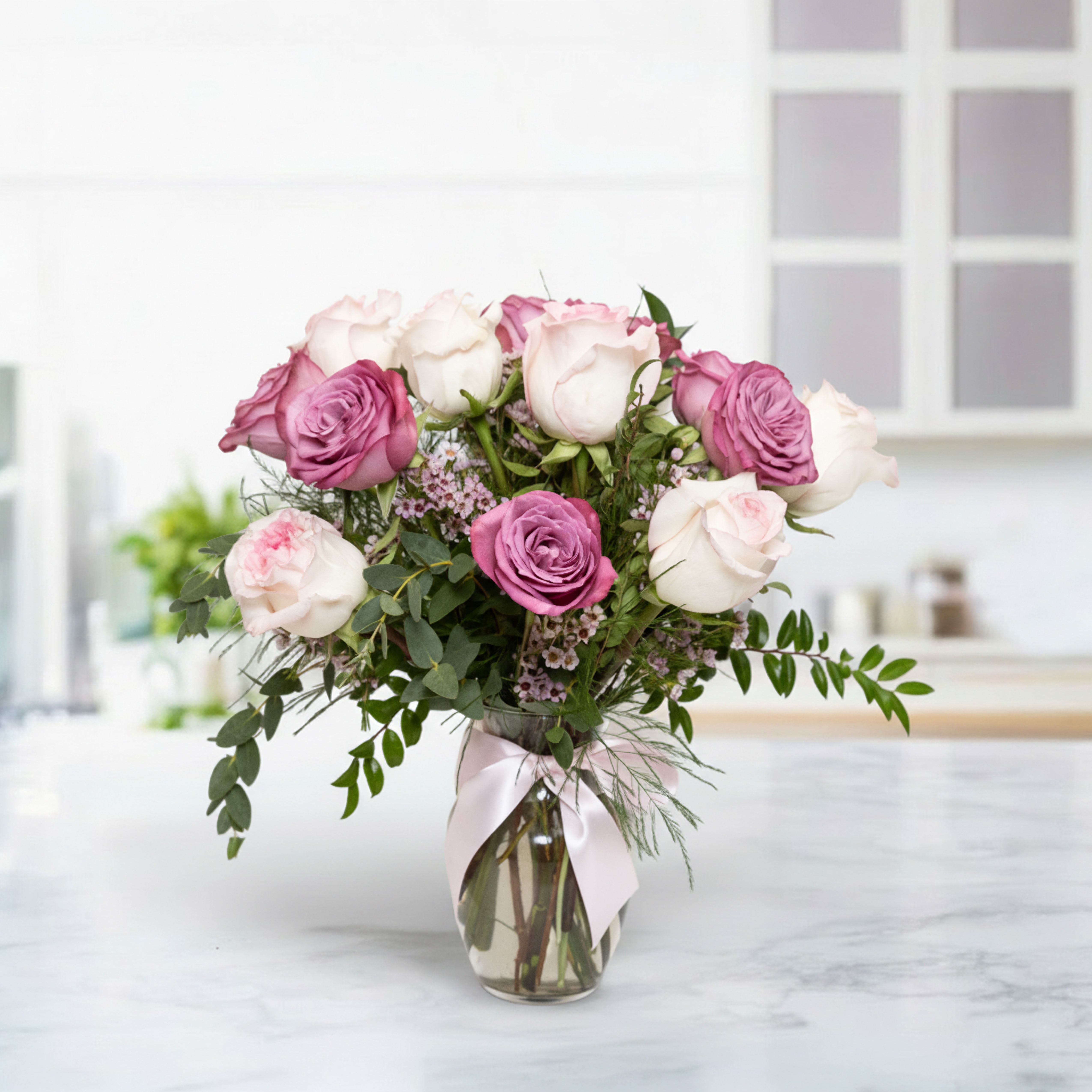 Lavender &amp; Pink Elegance - Lavender &amp; Pink Elegance is a stunning floral arrangement featuring premium pink and lavender roses paired with lush greenery. This bouquet exudes romance, sophistication, and timeless beauty, making it perfect for birthdays, anniversaries, weddings, or as a thoughtful gift for someone special. Its harmonious blend of soft pastel tones creates an elegant and unforgettable floral design.