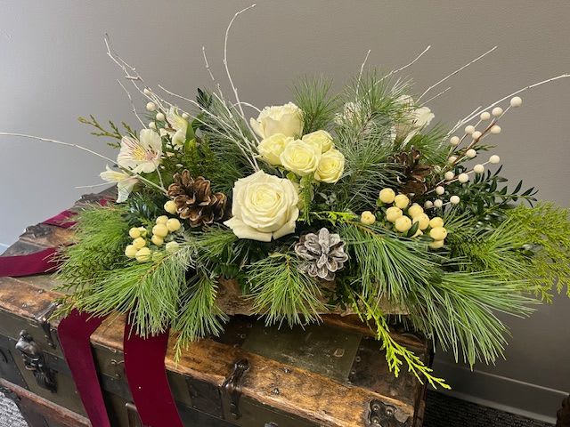 Dazzling Snowflake - Designed in a birch wooden box, Dazzling Snowflake is filled with fabulous smelling holiday greens such as white pine and cedar. White roses, berries, and birch branches are just some of the beautiful components in this design. Simple elegance. 