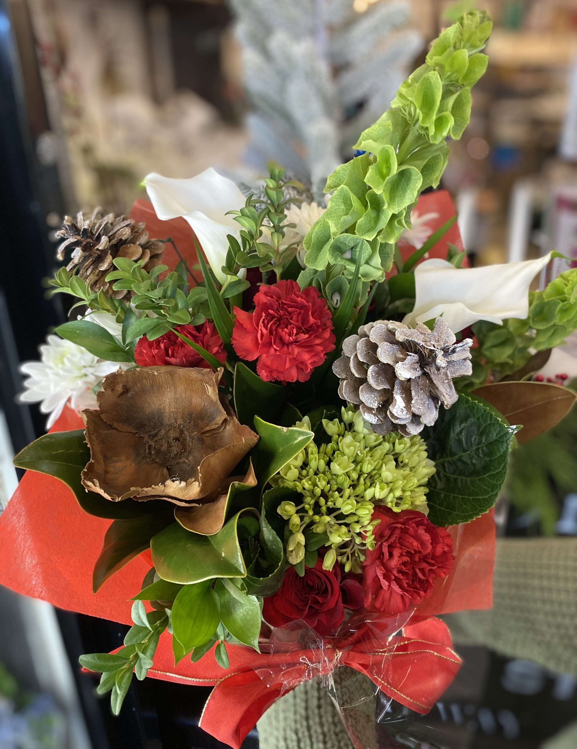 Classic Holiday Hand-Tied Bouquet - Our Classic Holiday Hand-Tied Bouquet incorporates a variety of festive colours and seasonal greens