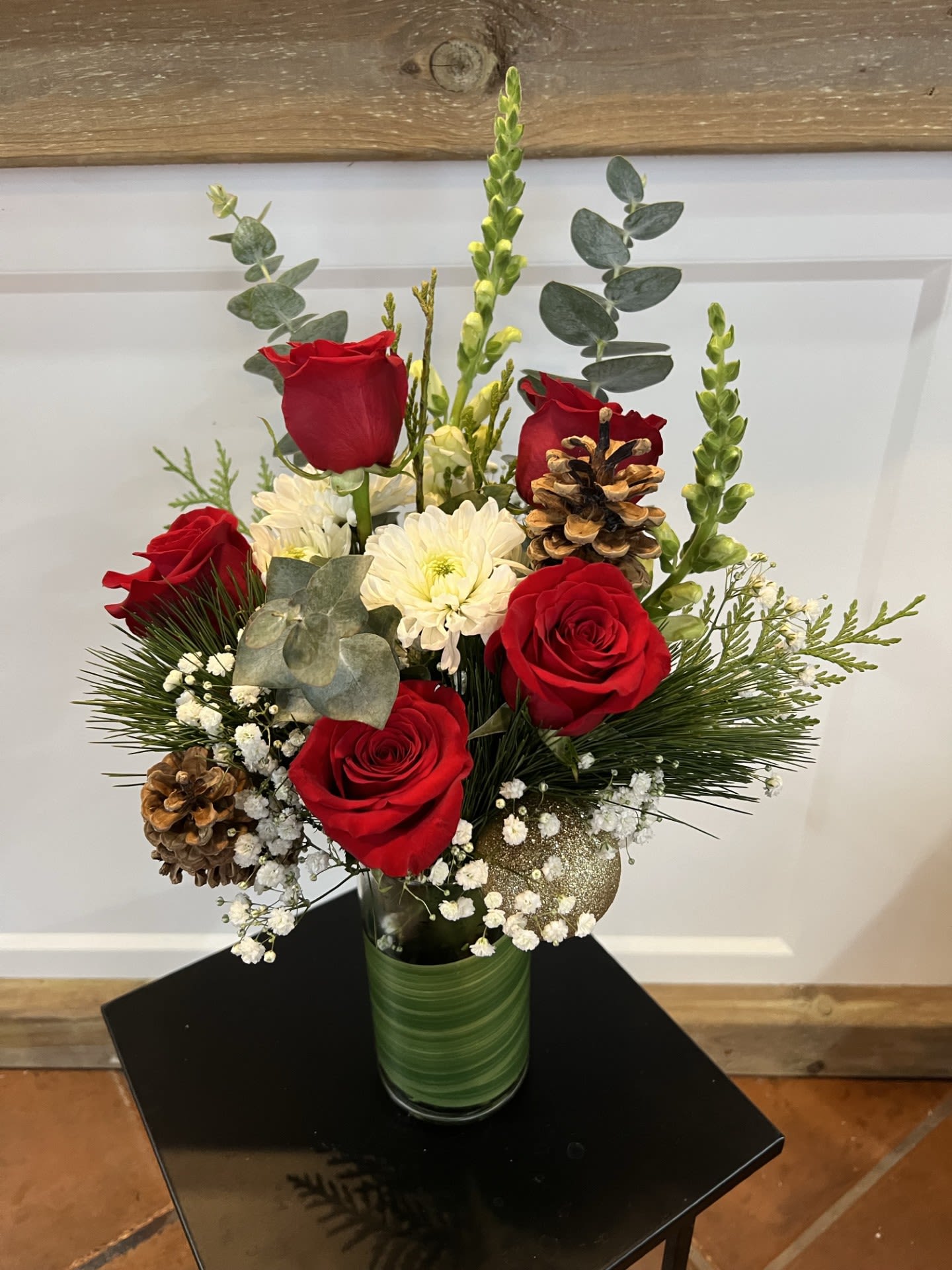 Elegant Christmas  - Looking for a beautiful holiday gift? This arrangement embodies the holiday season with elegant red roses, winter greenery, eucalyptus and other Christmas decorations.