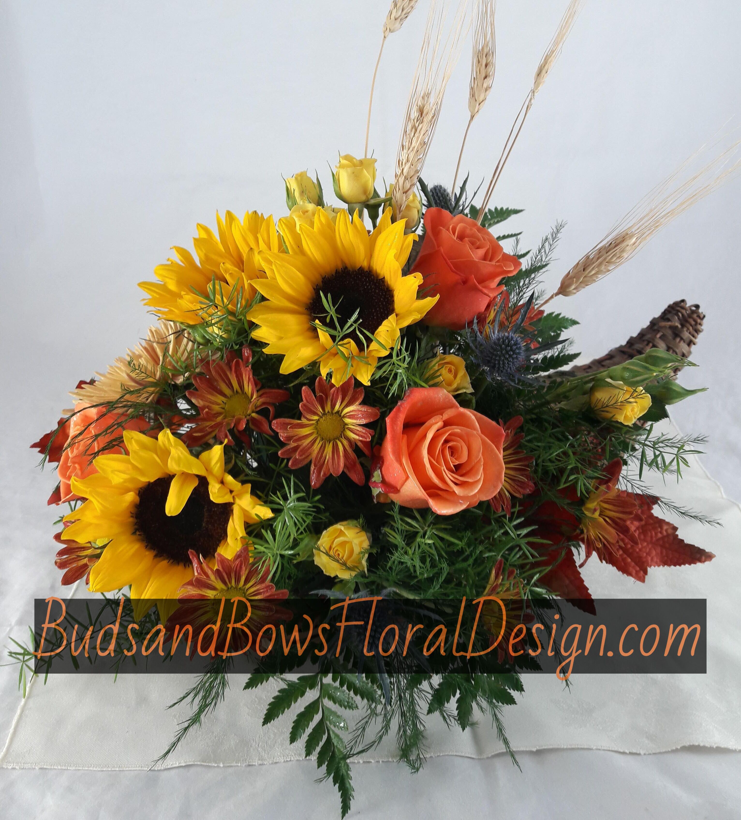 Cornucopia - Send a symbol of tradition and family.   In classical antiquity, the cornucopia was a symbol of abundance and nourishment, commonly a large horn-shaped container overflowing with produce, flowers, or nuts. It is also called the horn of plenty, and comes from the Latin word for horn and abundance.  Cornu (horn) and copia (abundance), 